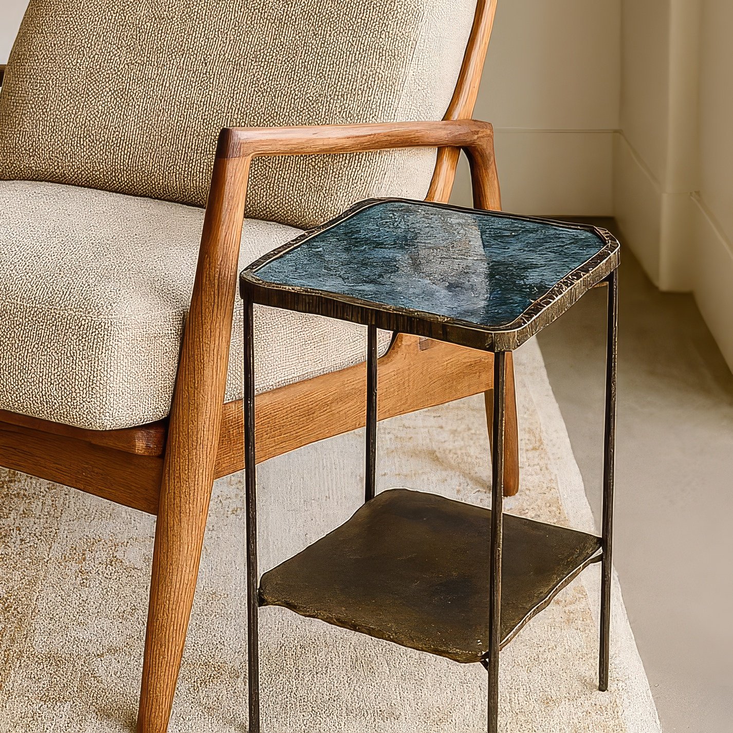 Iridescent labradorite stone top accent table with iron frame and lower shelf