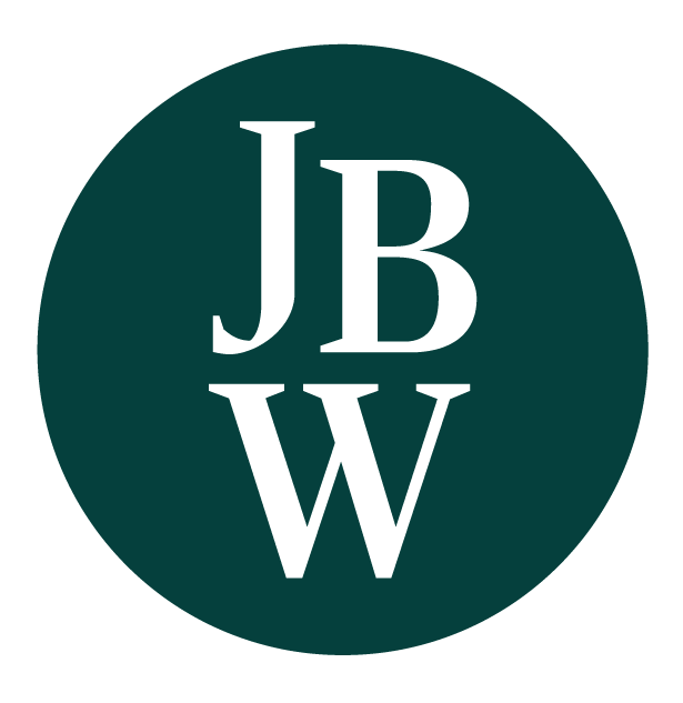 Brown circle with white letters 'JBW' inside