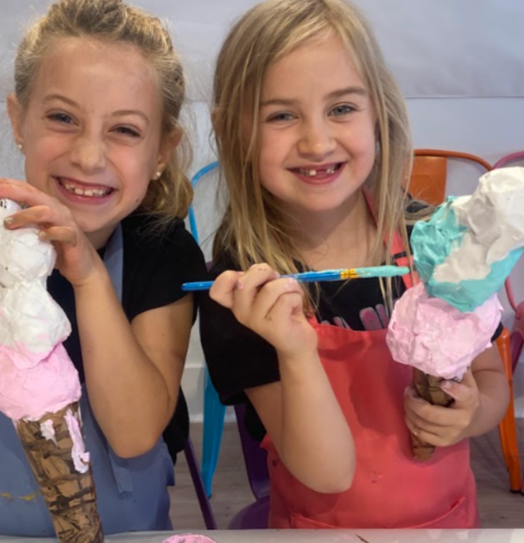 Kids creating colorful art projects during summer art camp at Whimsy Wees Art Studio in Beaverton