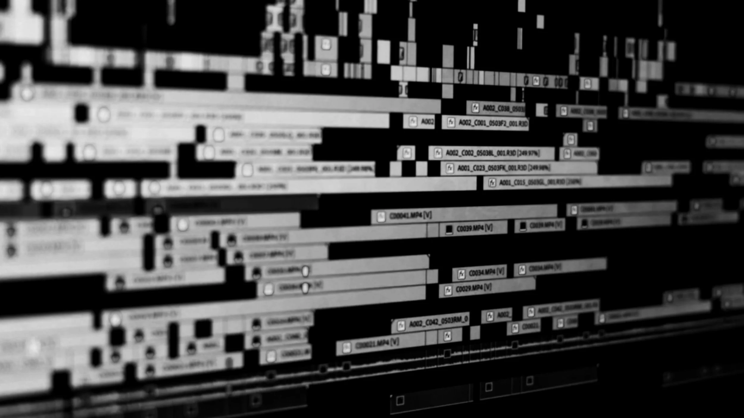 Black and white digital audio editing software interface with multiple audio tracks and waveforms.