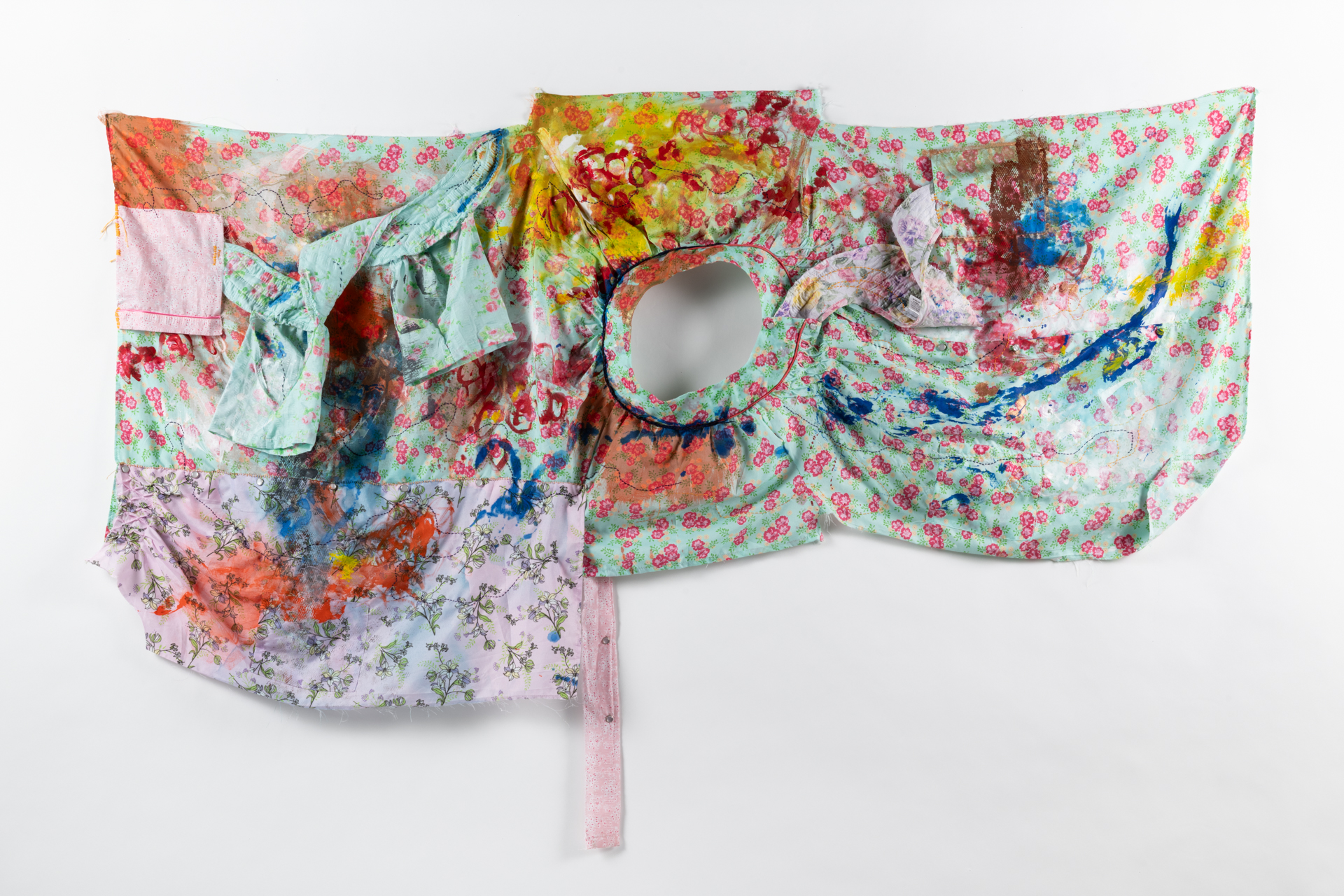 fabric collage with bright flowered patterns, paint and stichwork