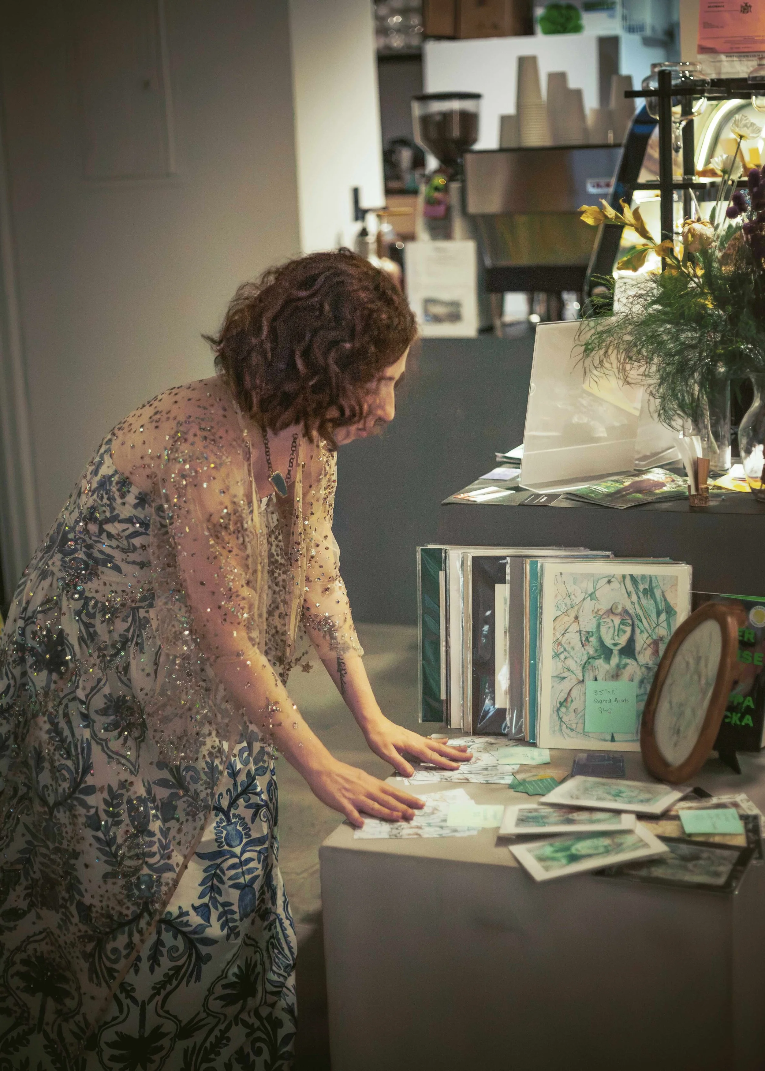 nicole-javorsky-sets-up-prints-area-at-art-show.jpeg