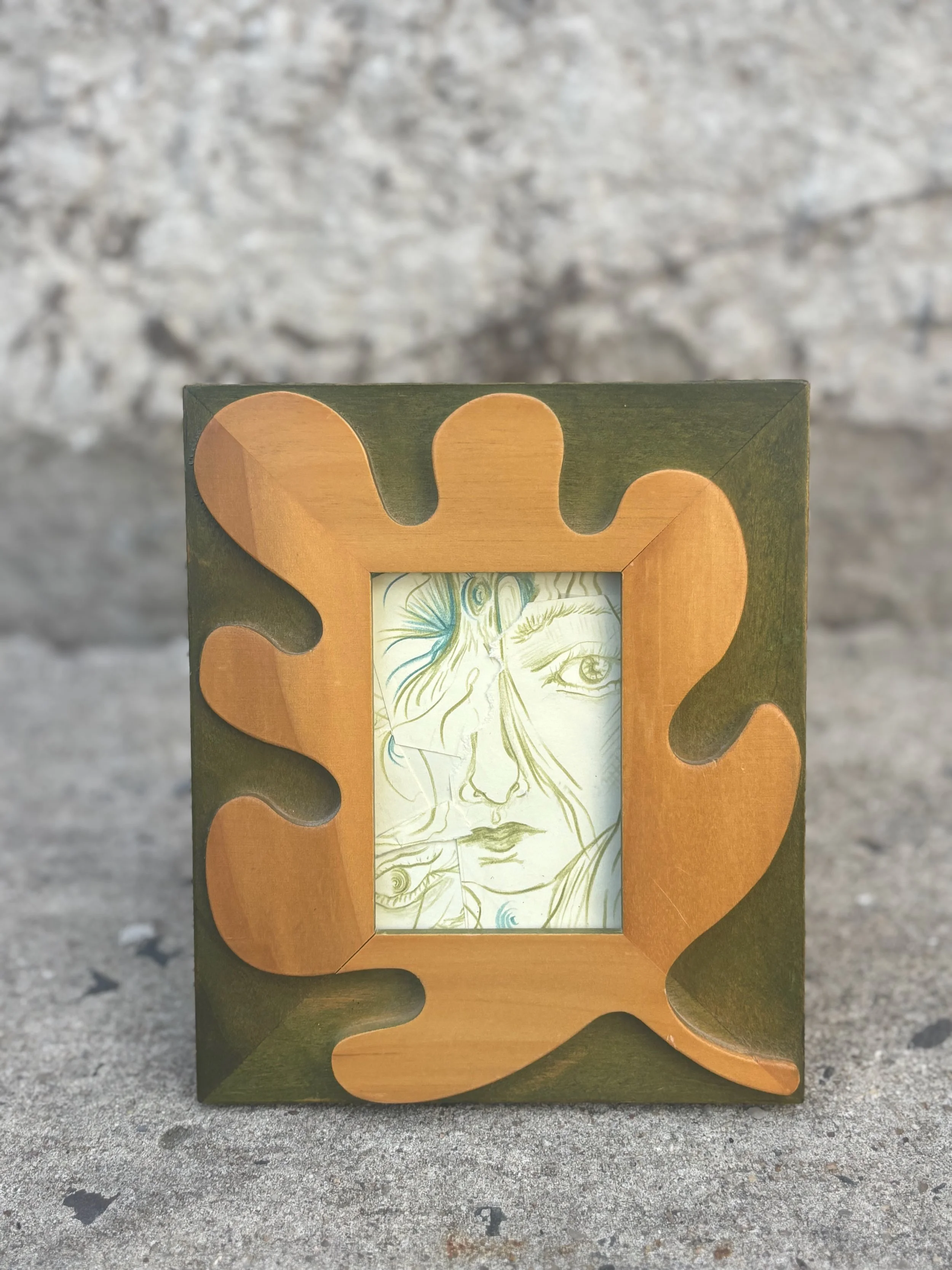 collage in unique green and tan leaf-shaped frame.jpeg