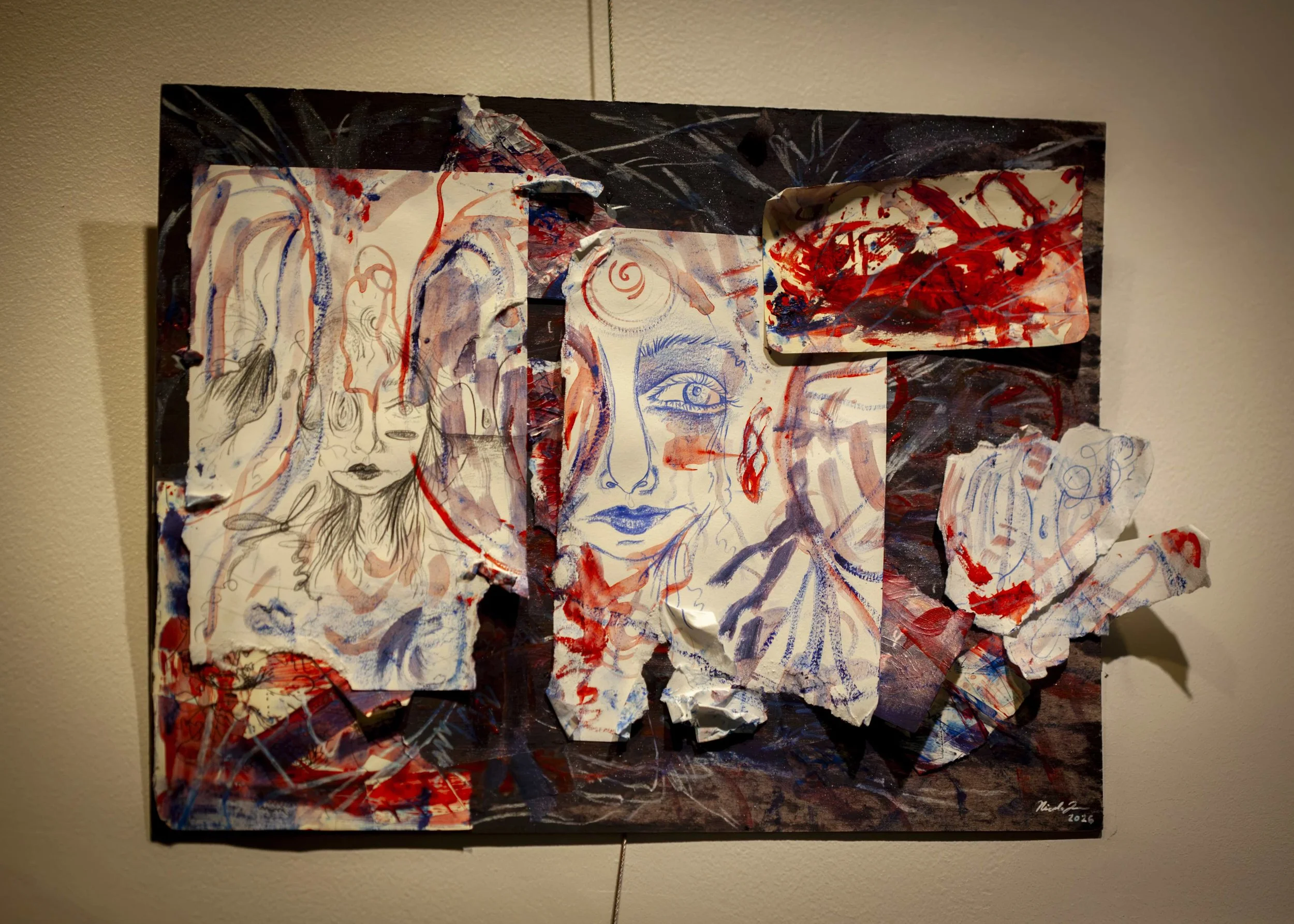 mixed-media-artwork-on-gallery-wall.jpeg