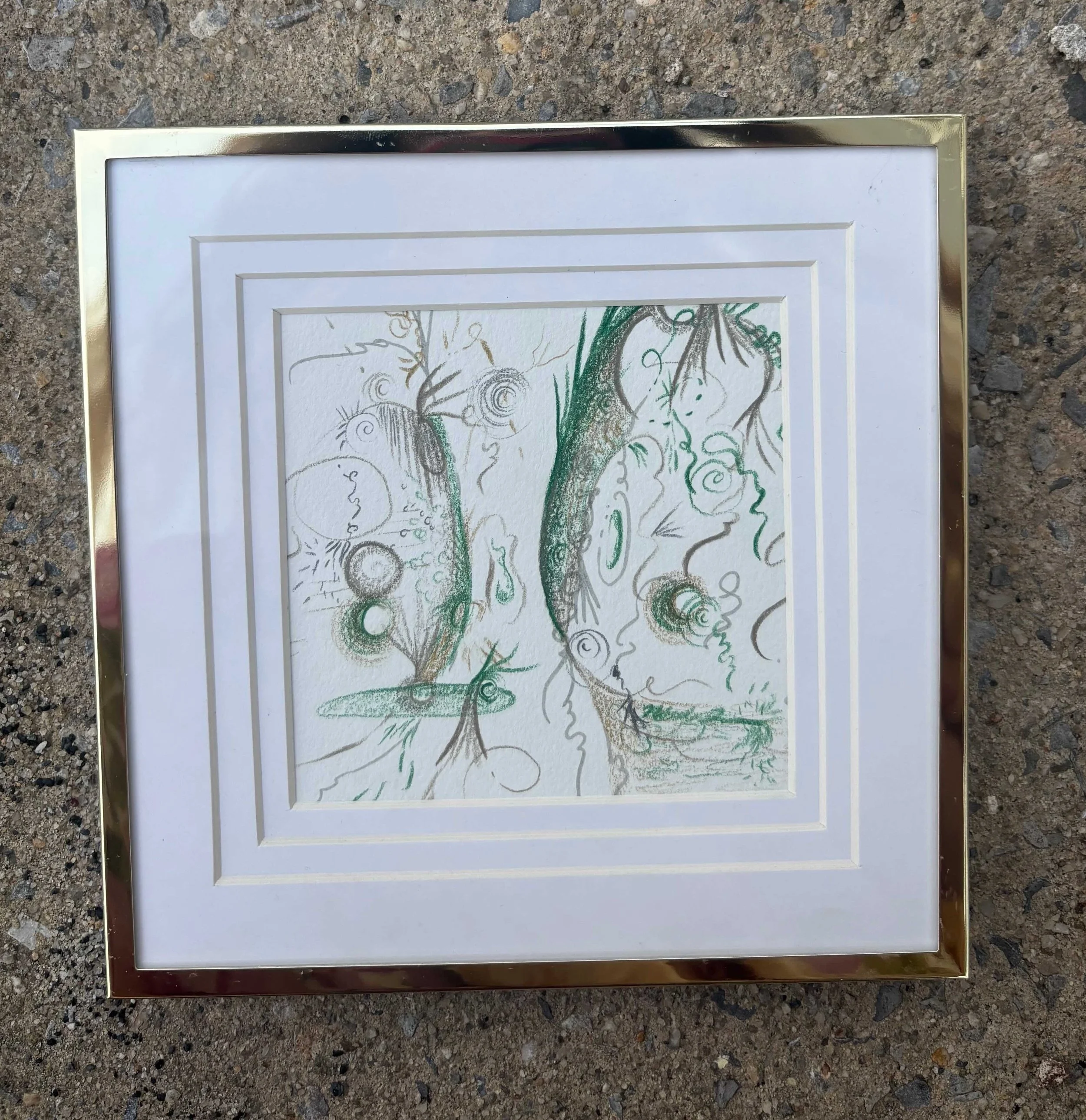 framed-and-matted-drawing-in-gold-frame-on-concrete.jpeg