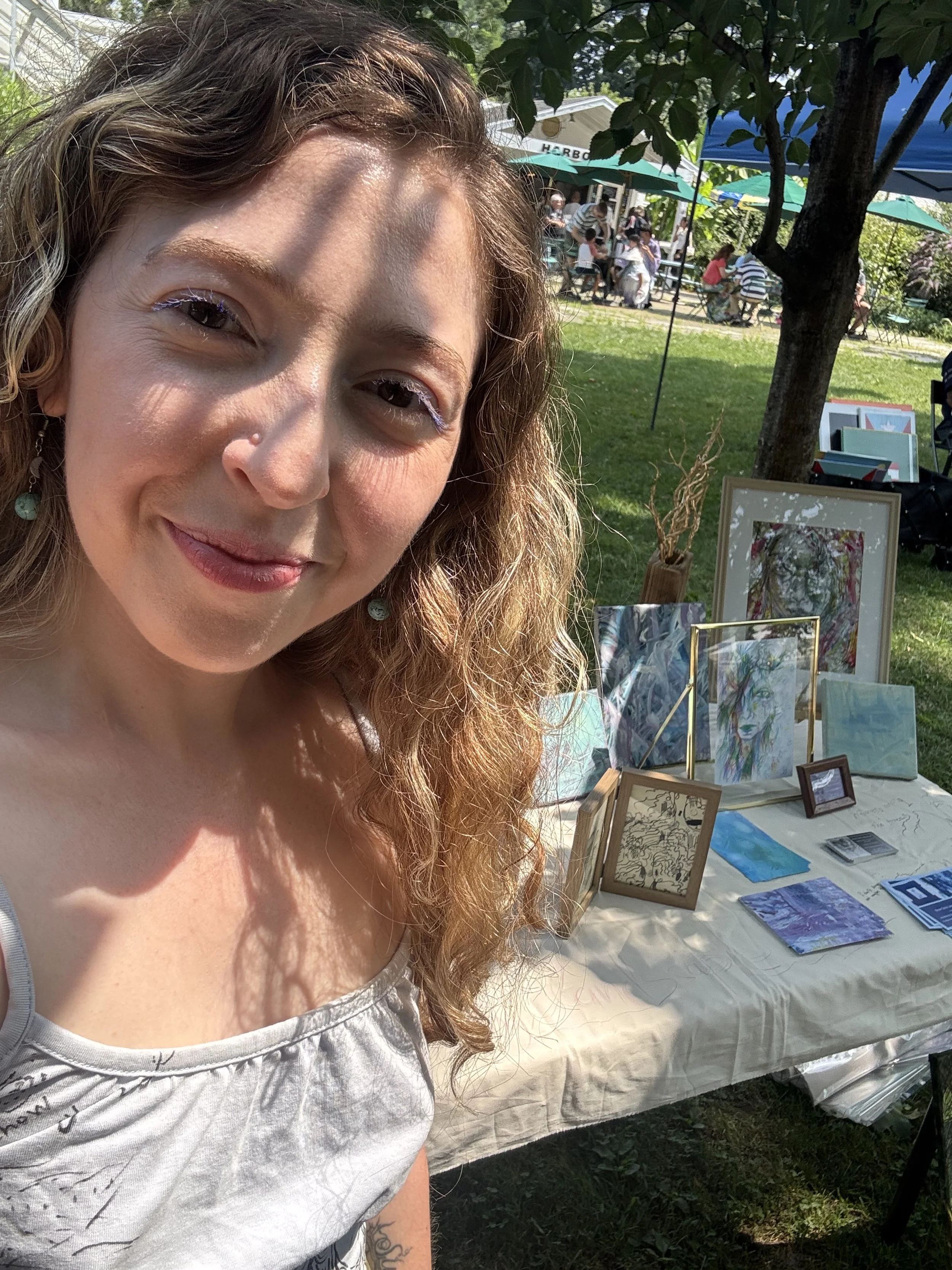 photo of Nicole sharing her artwork