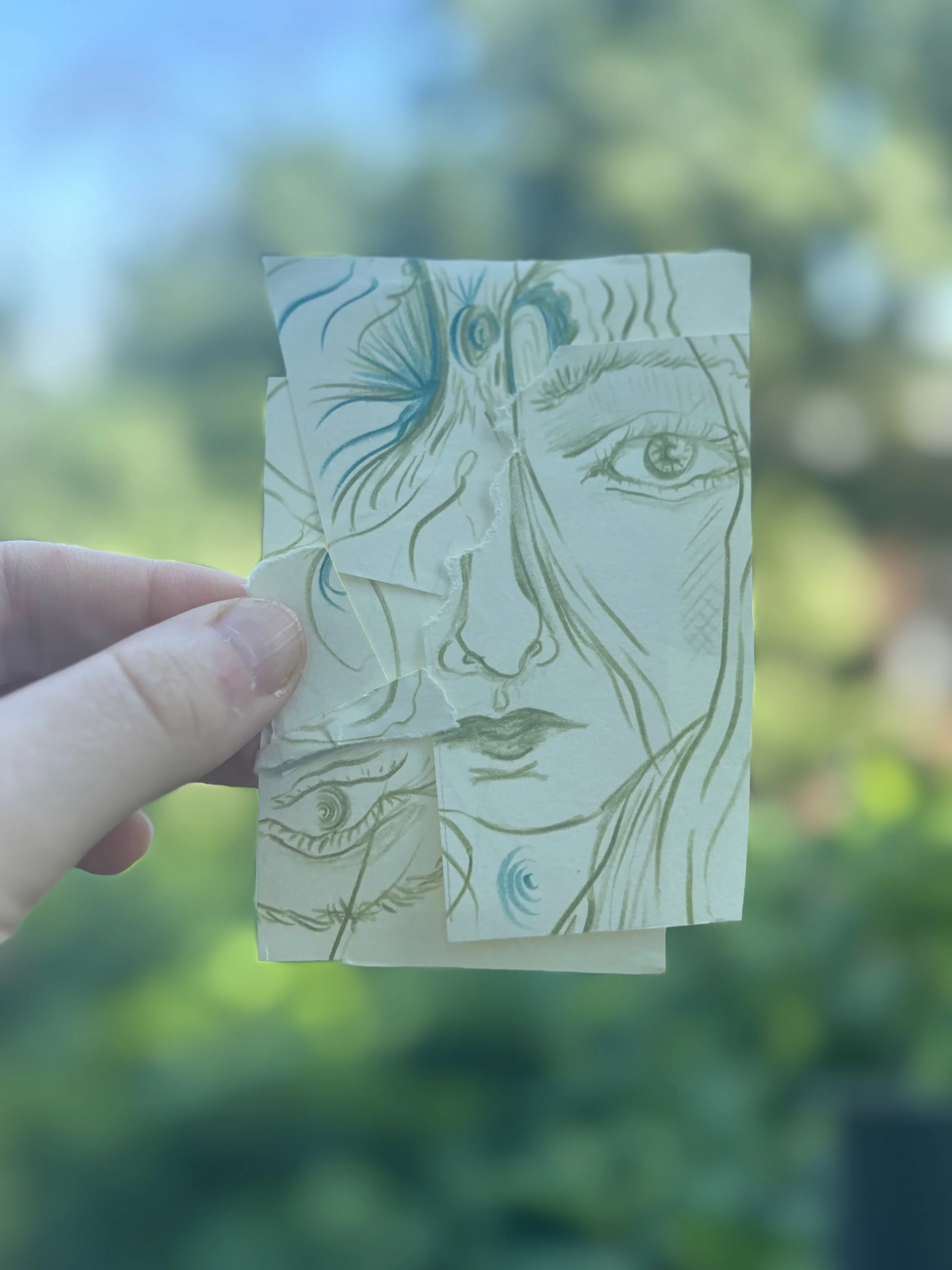 original artwork with a ripped face pieced together.jpeg
