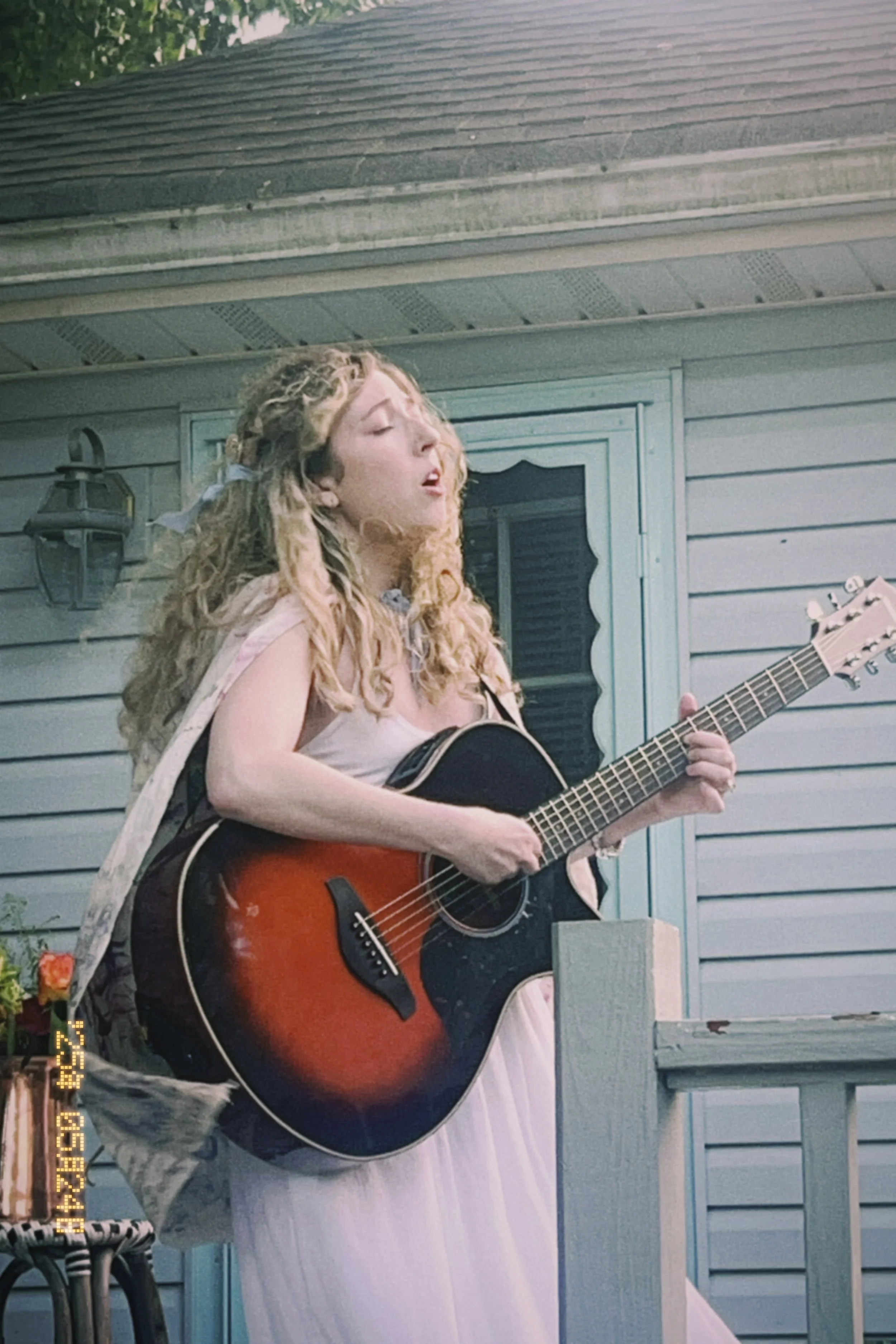 Alice Celeste performing at a house concert in New Jersey