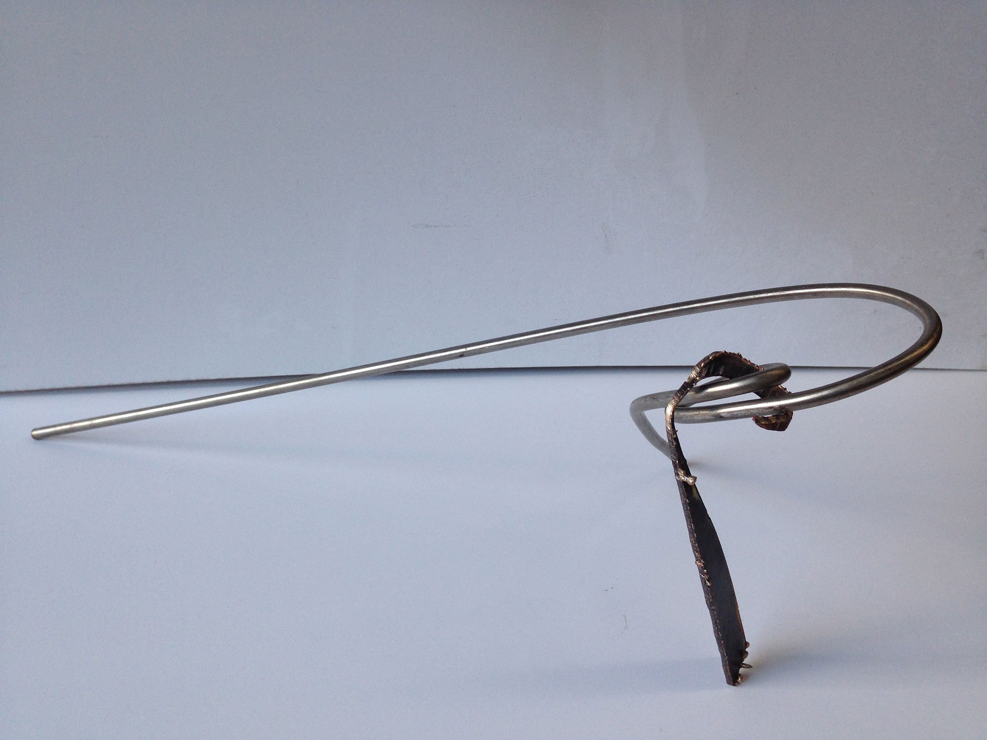 Title Slip Stream..
Material Stainless Steel and Bronze.
Size 30 cm by 12 Cm.
Year 2020.
Private Collection Ireland