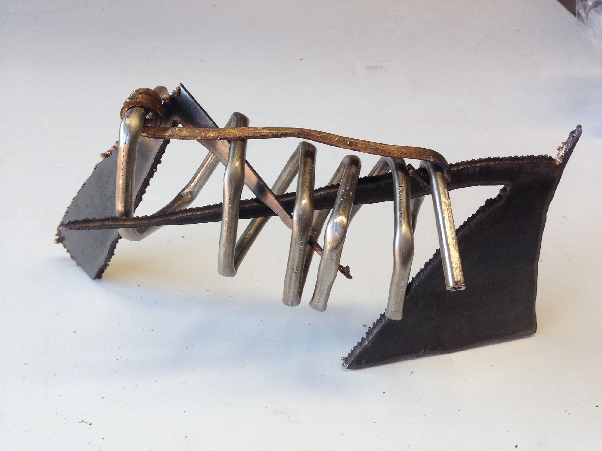Title Compress.
Material Stainless Steel and bronze.
Size 25cm long 12cm high.
Year 2019.
Private Collection Ireland.