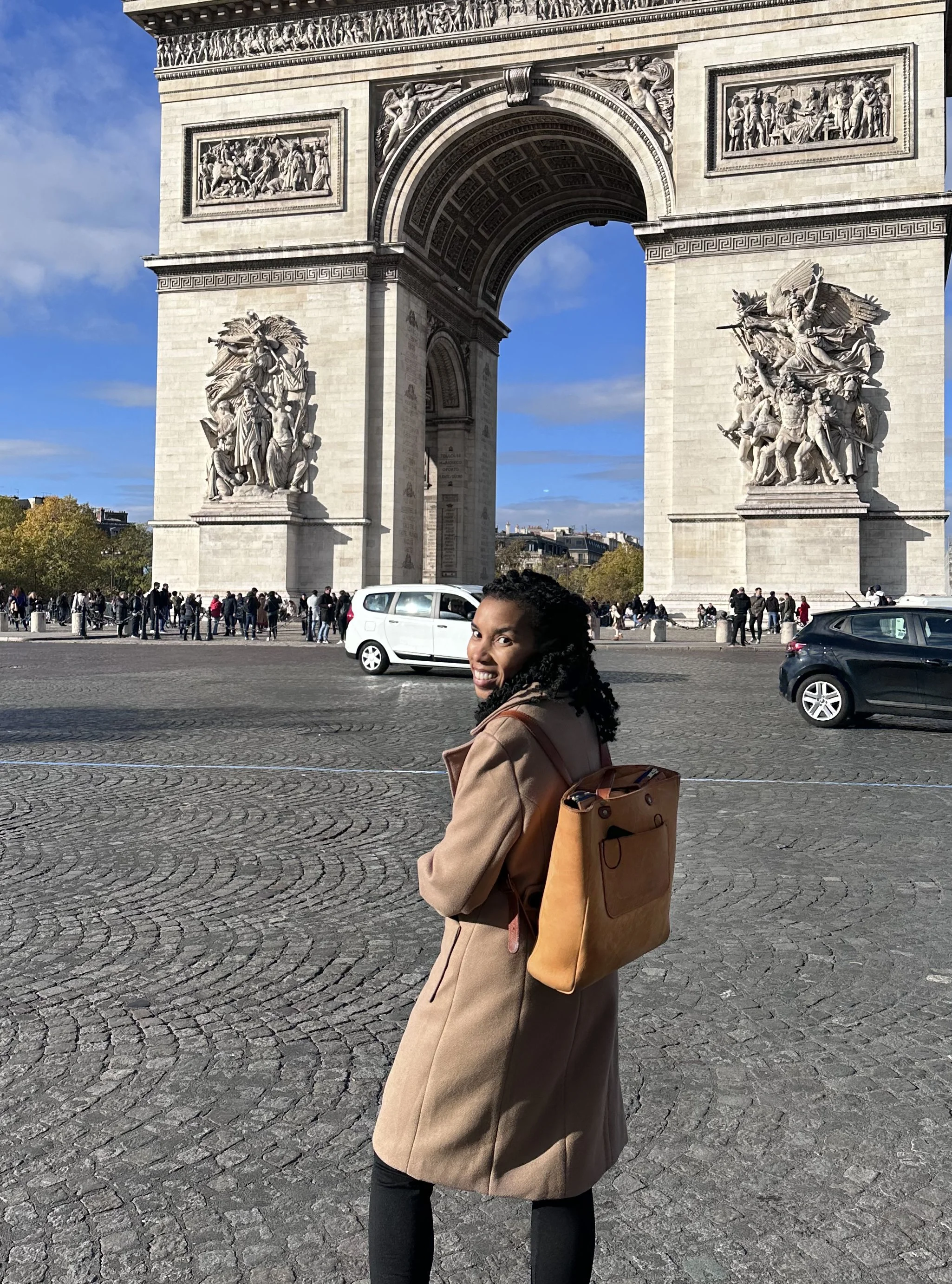 woman wearing Ziggy backpack in Paris outside Arc De Triomphe