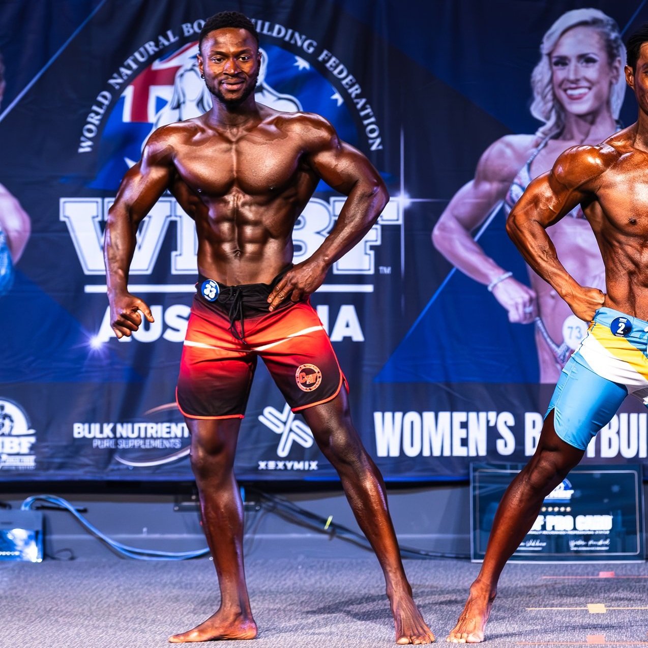 MAASTRICHT, THE NETHERLANDS - OCTOBER 25, 2015: Male physique model shows  his best back pose at championship on stage Stock Photo - Alamy