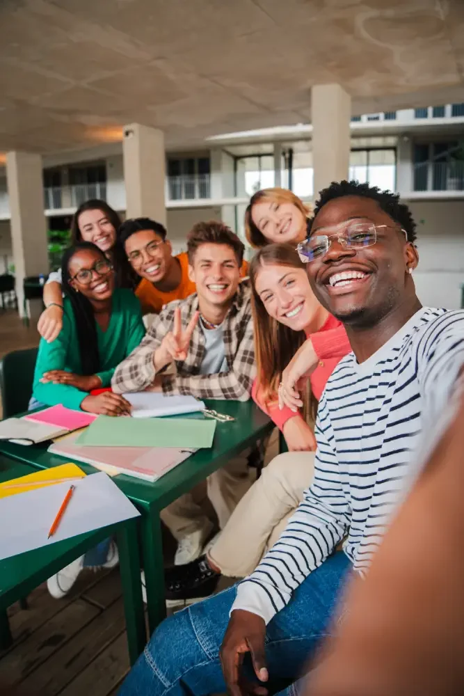 Group of teens smiling together in a supportive environment, representing teen counseling in Phoenix AZ