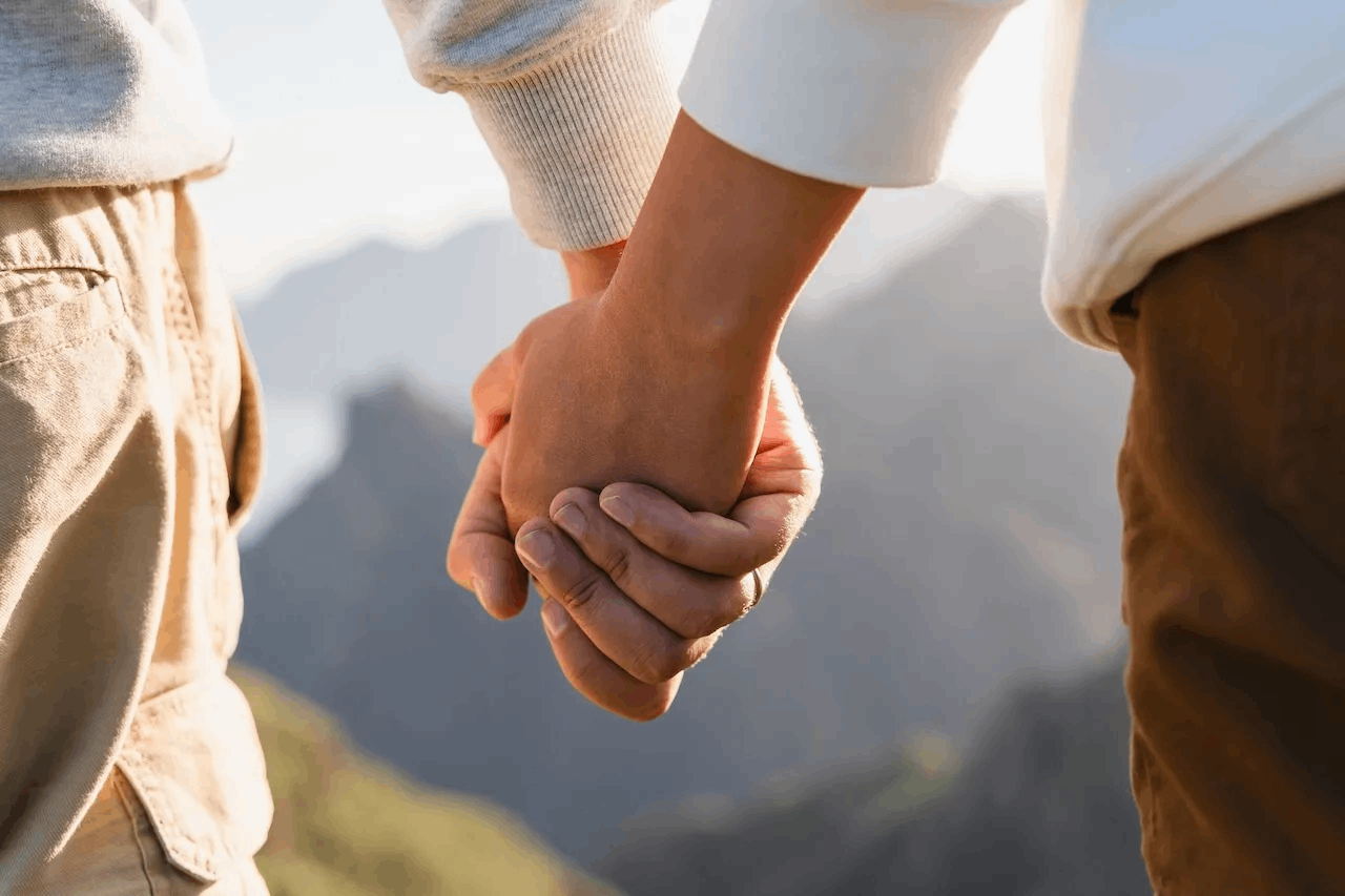 Partners sitting apart in silence showing emotional distance and disconnection in a relationship