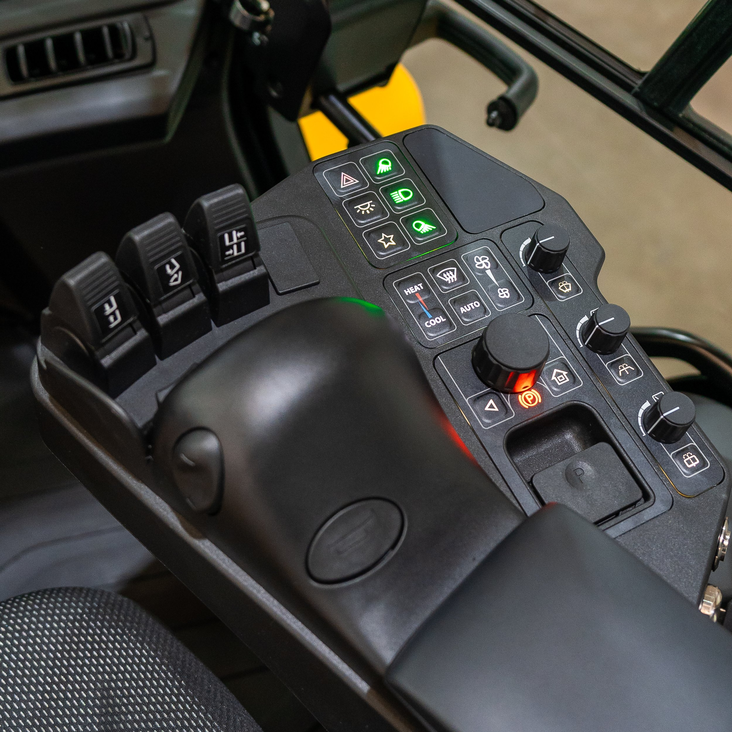 Close-up of vehicle control panel with buttons and switches
