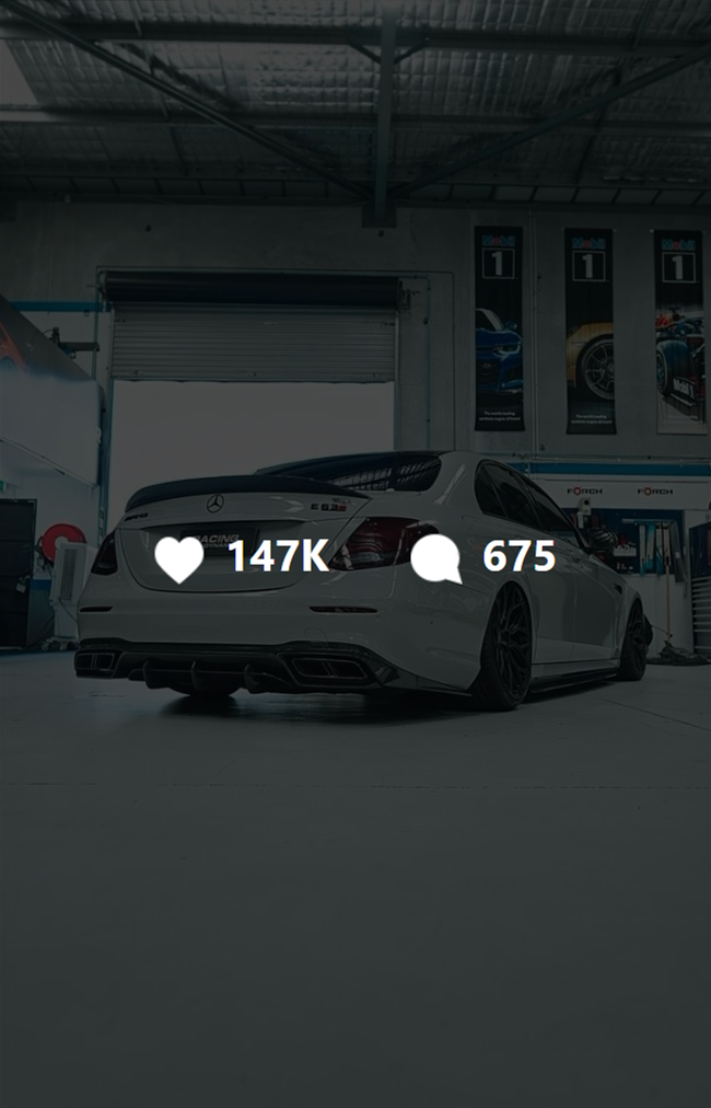 Thumbnail of a video showing a custom grey Mercedes-Benz E63S sedan with black wheels in a mechanical workshop. The video has 147k likes and 675 comments on the Instagram UI.