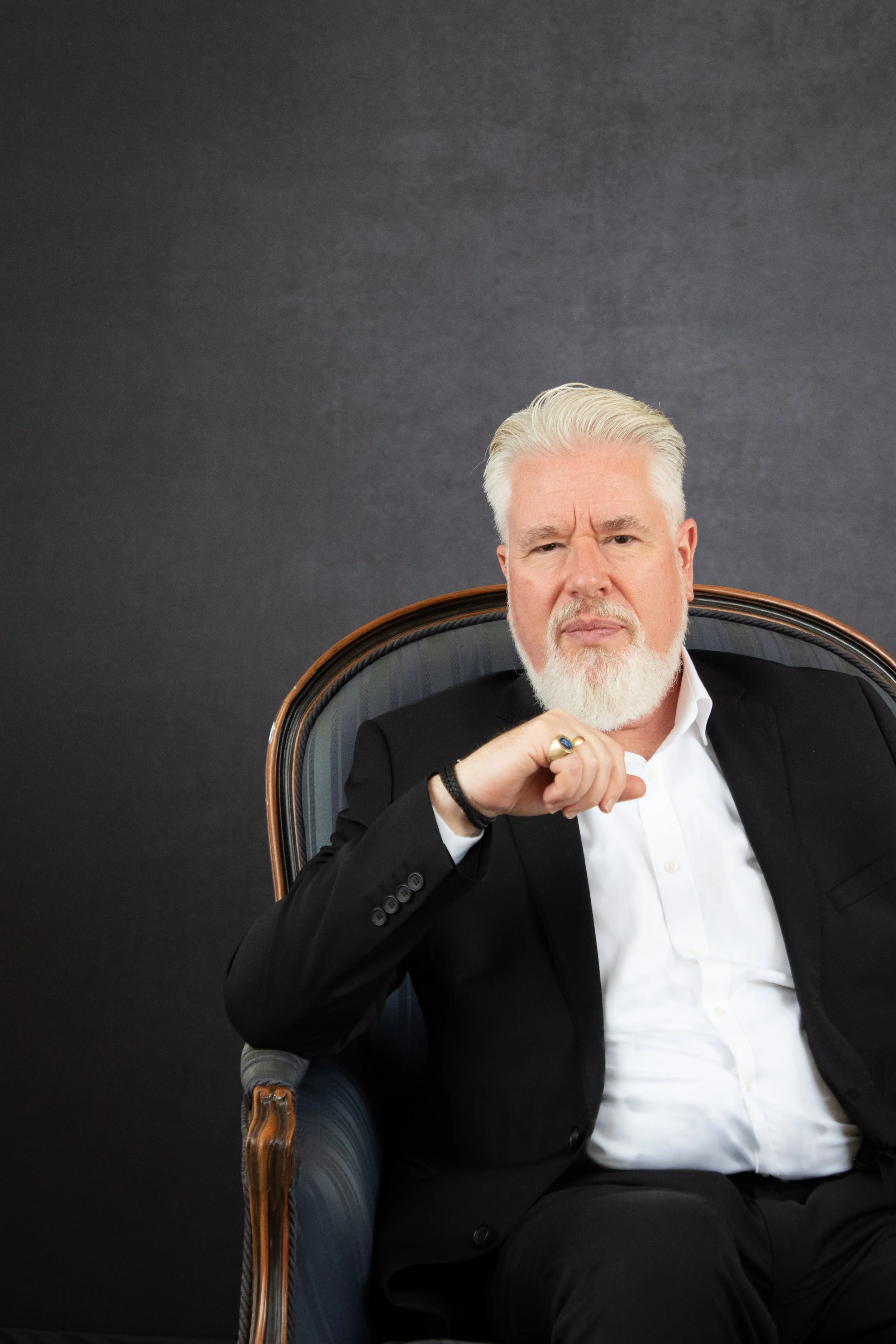 Commercial headshot of operatic bass James Creswell wearing a white shirt at The Daylight Space in Manchester, photographed by Sarah Foubert.
