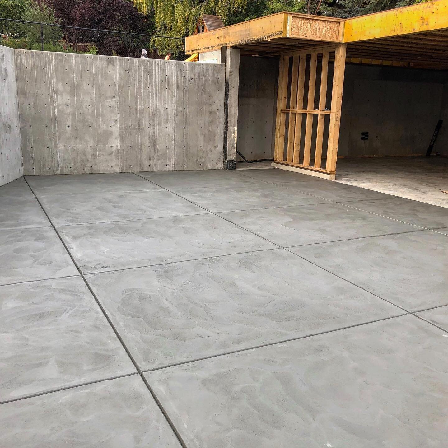 Suede finish driveway really compliments this modern garage build. With suspended slab and secondary suite above. Very happy how this turned out! #lmcconcrete #concrete #driveway #garage #wall #yycconcrete #calgaryconcrete #calgaryconstruction