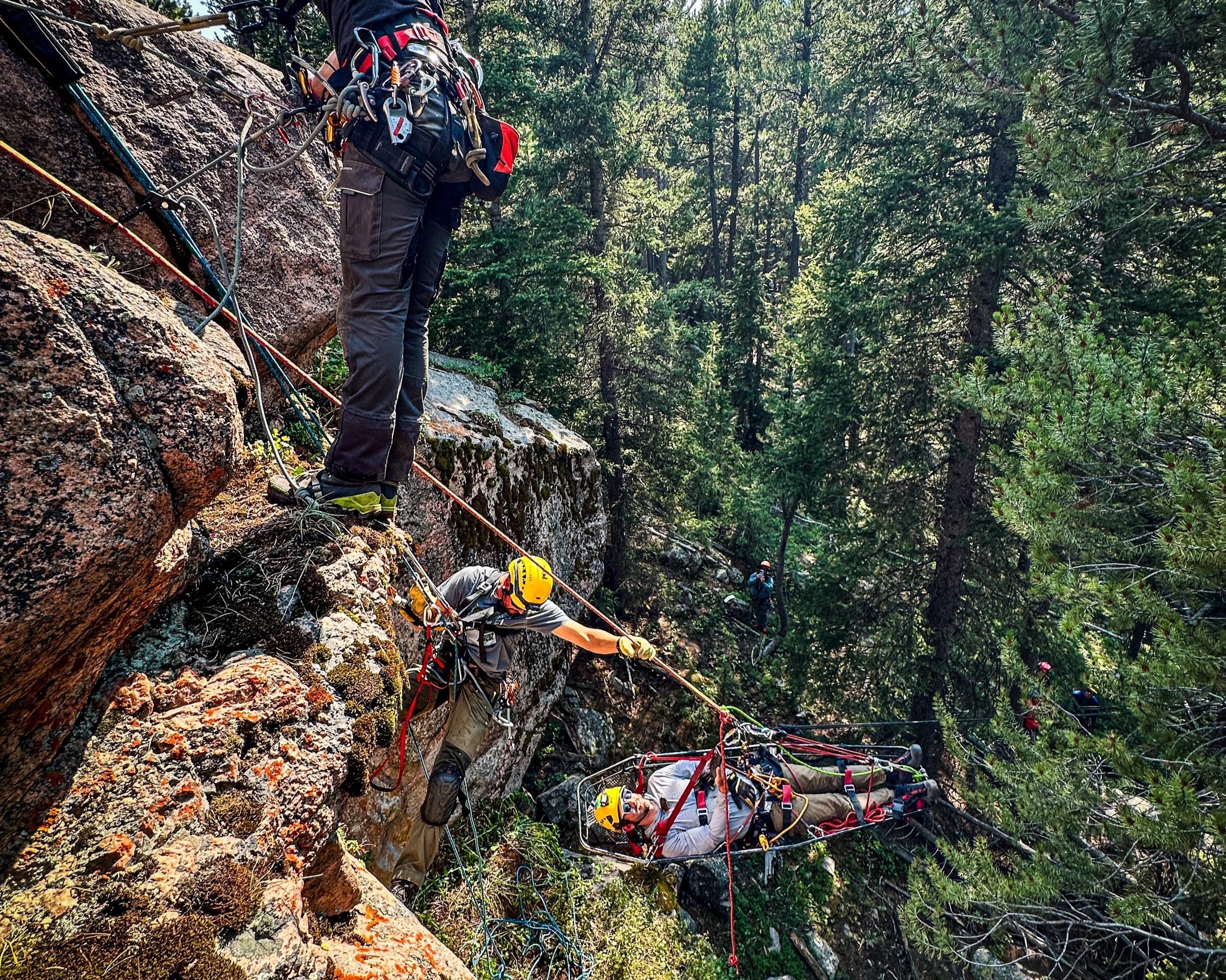 Technical Rescuers navigate difficult Edge Transitions with patient in litter