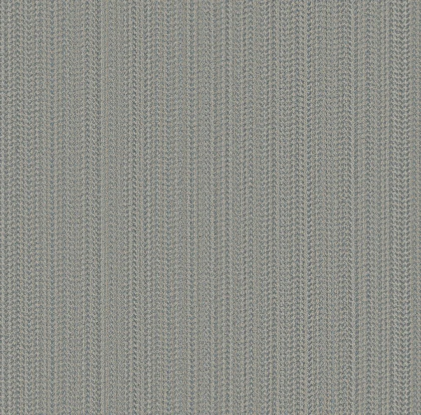 Close-up of textured fabric with a herringbone pattern in beige and light blue colors.