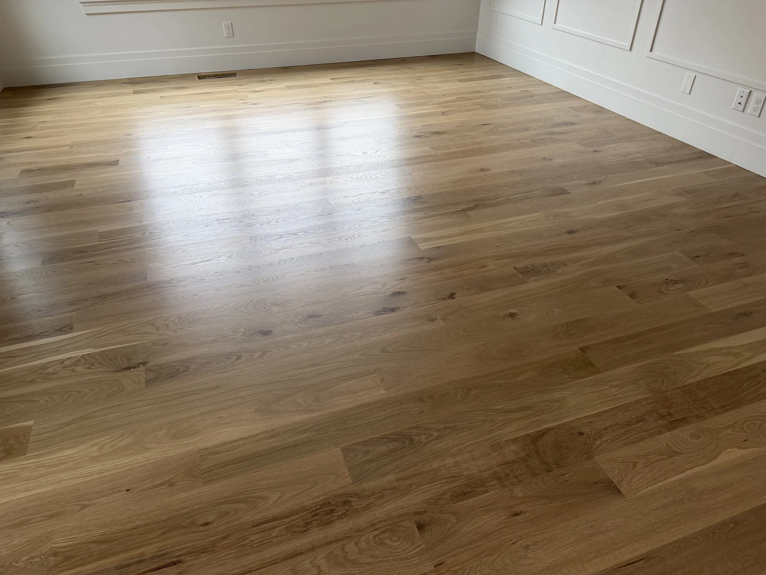 Refinished white oak floors in a bedroom