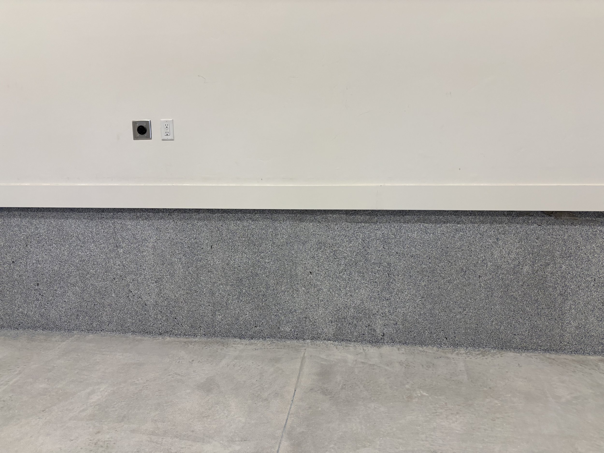 Garage epoxy flecks going up the wall.