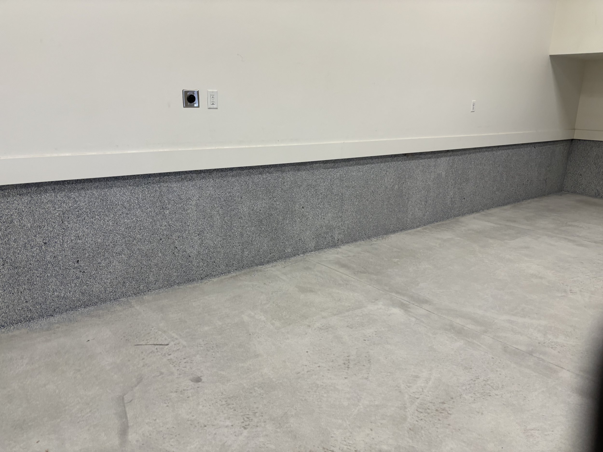 Garage epoxy flecks going up the wall.