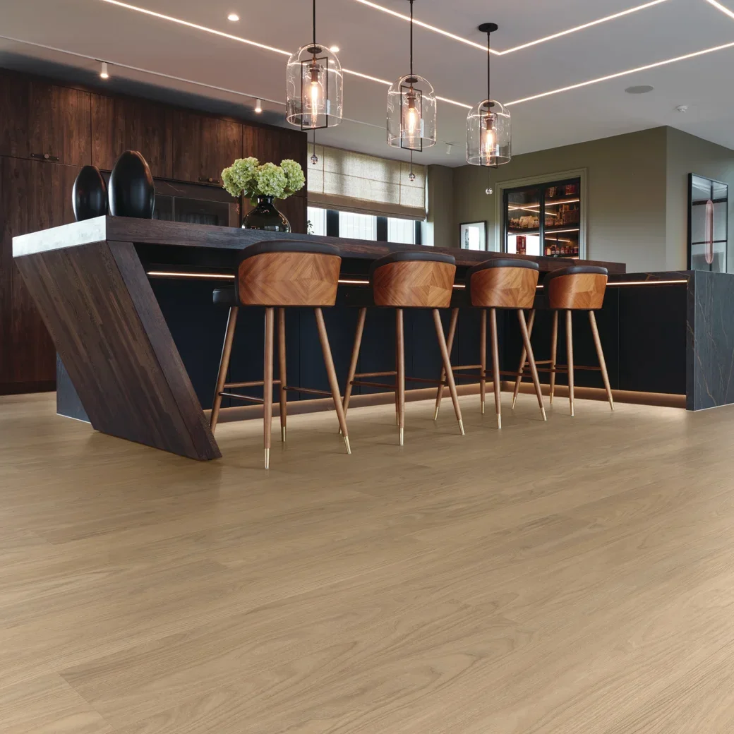 A moody, modern kitchen, with a light colored floor with dark, wooden countertops