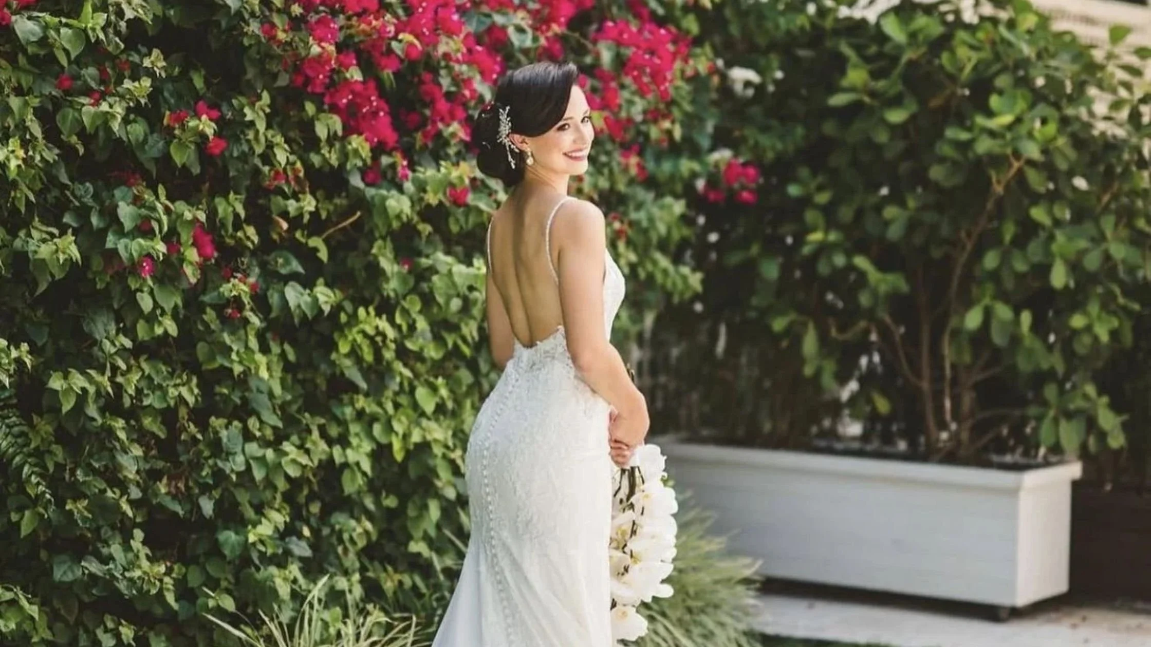 Bride in front of flowers