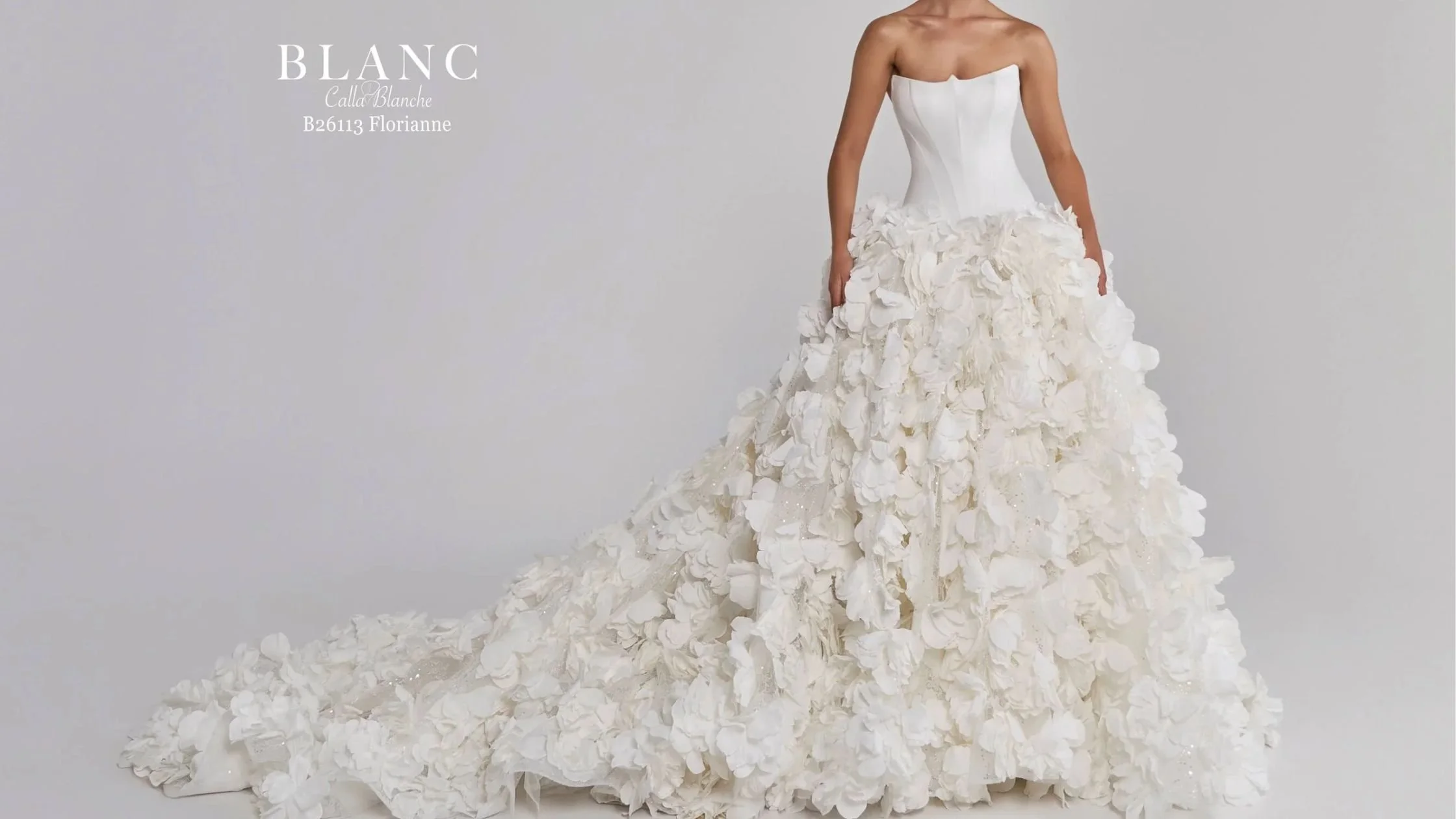 Bride in strapless wedding gown with rosette skirt