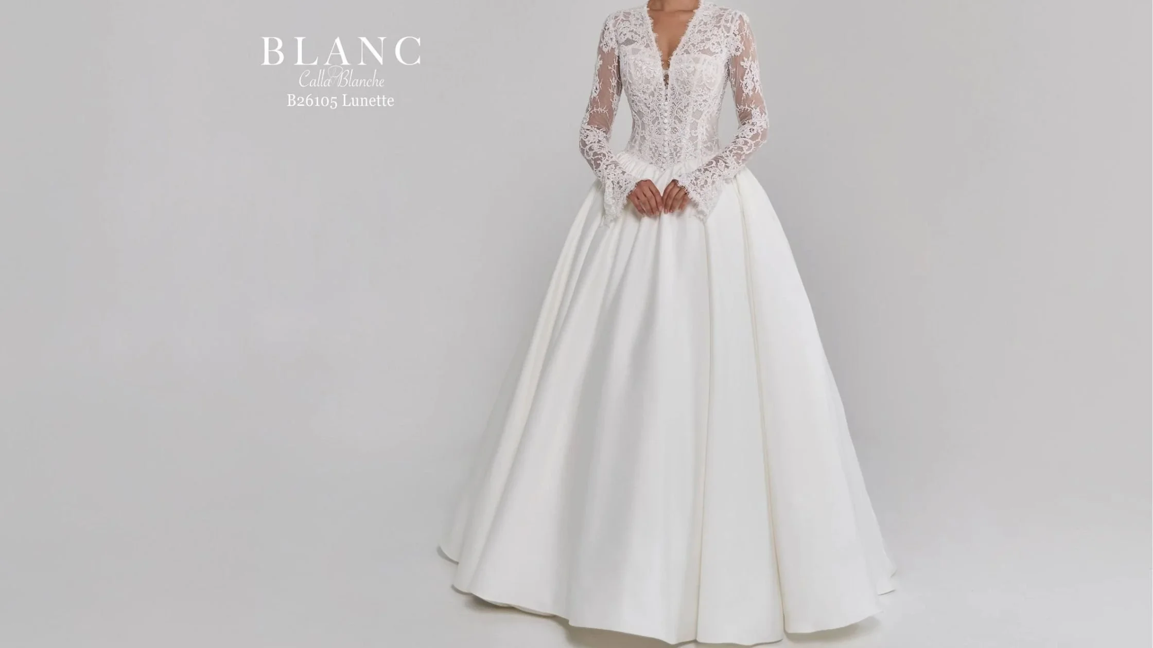 Bride in long sleeve wedding gown