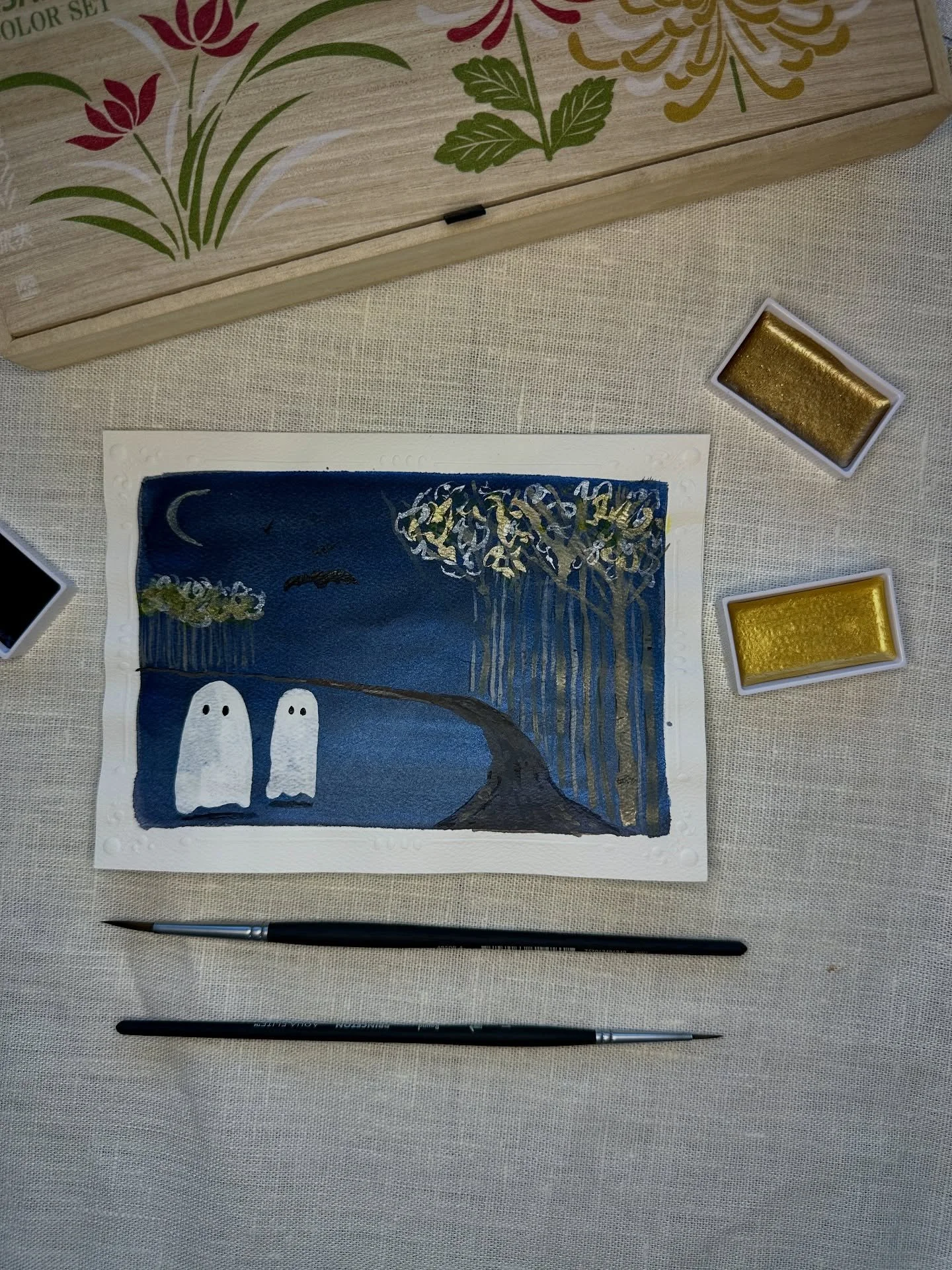 Sometimes I forget to lighten up and play. I scavenged some watercolor card paper from a donation pile and decided to experiment and made this cute ghostly card. Not my favorite medium, but I think it turned out just right. 
Do you go all out for Ha