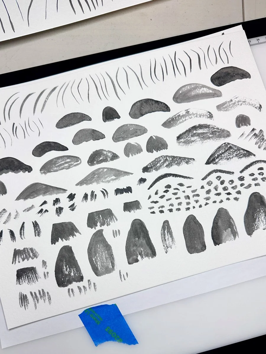 page of watercolor marks of mushroom shapes featuring texture