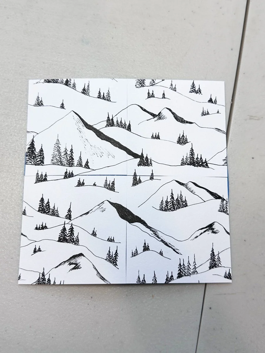 analog repeating pattern featuring mountains and trees