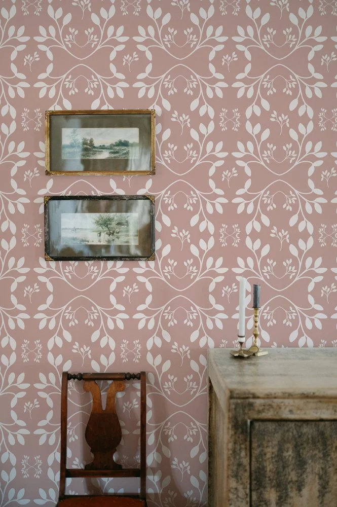 Wallpaper mockup featuring garden leaves in a romantic dusty rose. 