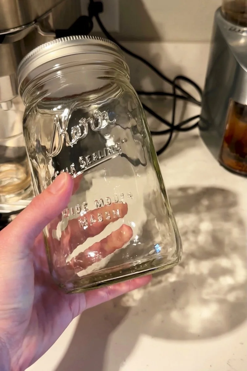 glass mason jar in a hand