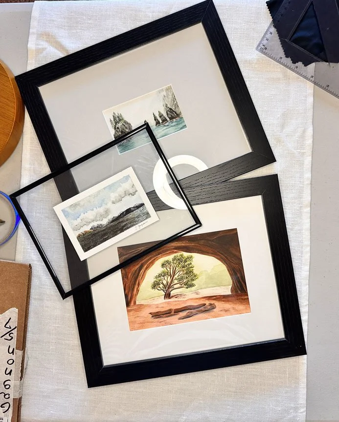 overhead view of three frame options holding original art