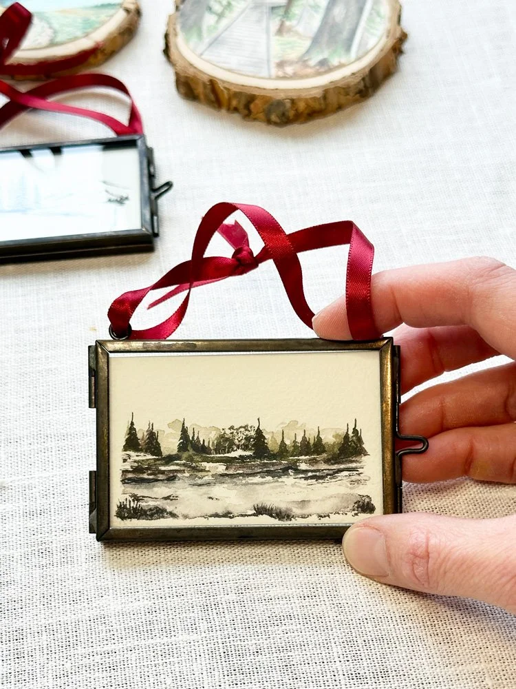 small watercolor painting in a 2 x 3 inch glass frame with side clasp