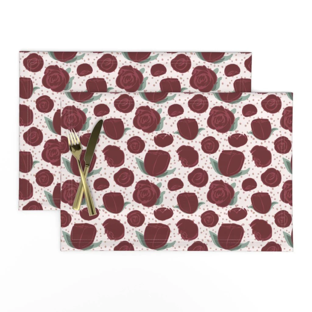Placemat mockup featuring red roses on a pink background. 