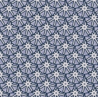 Close-up of a fabric pattern with blue and white geometric shapes resembling stylized flowers or stars.