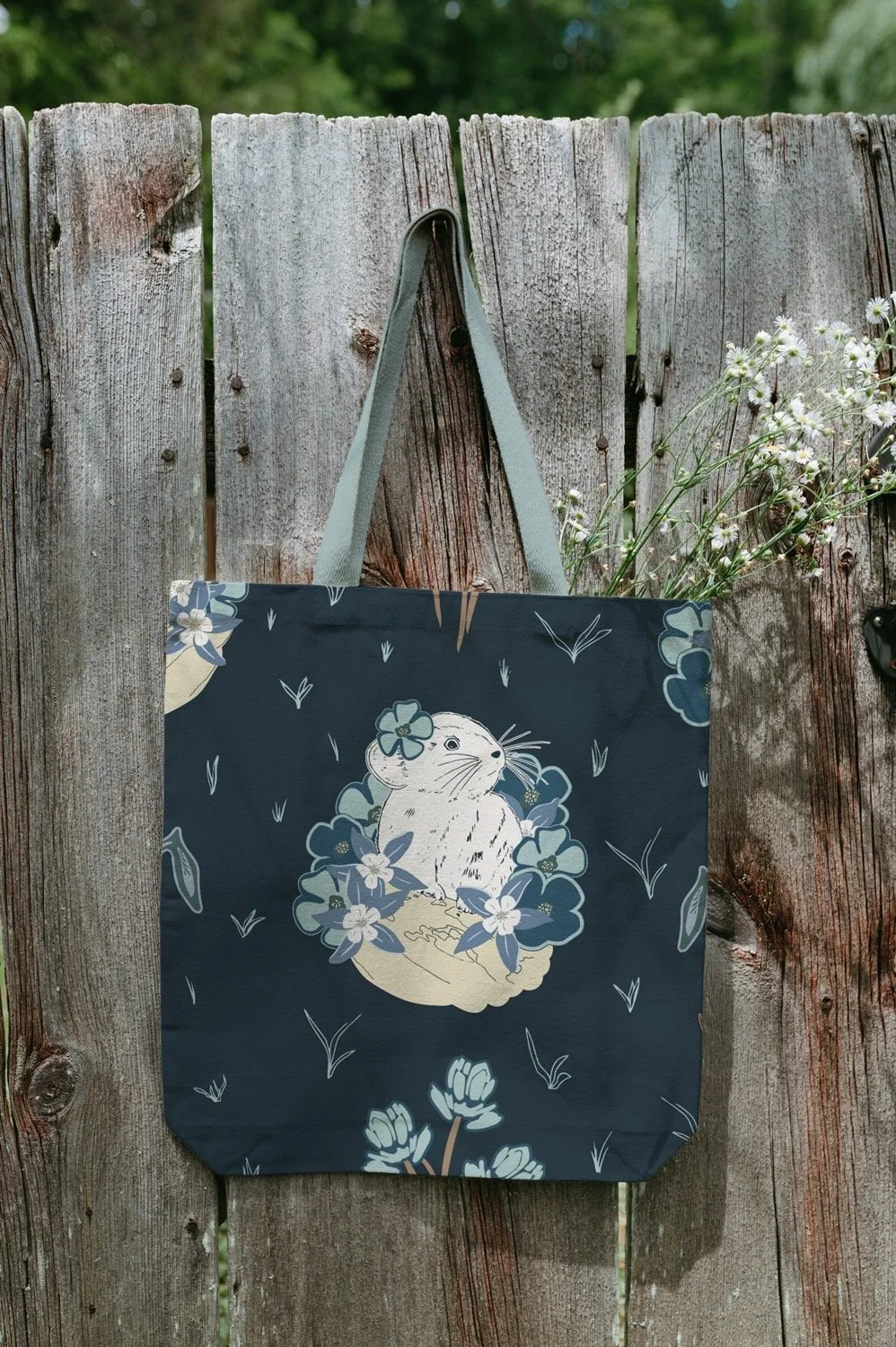blue tote bag with a pika print.