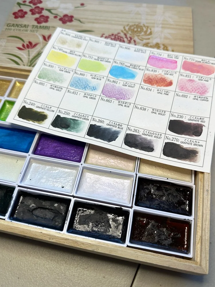 View of gansai tambi watercolor in storage tray with included swatch card