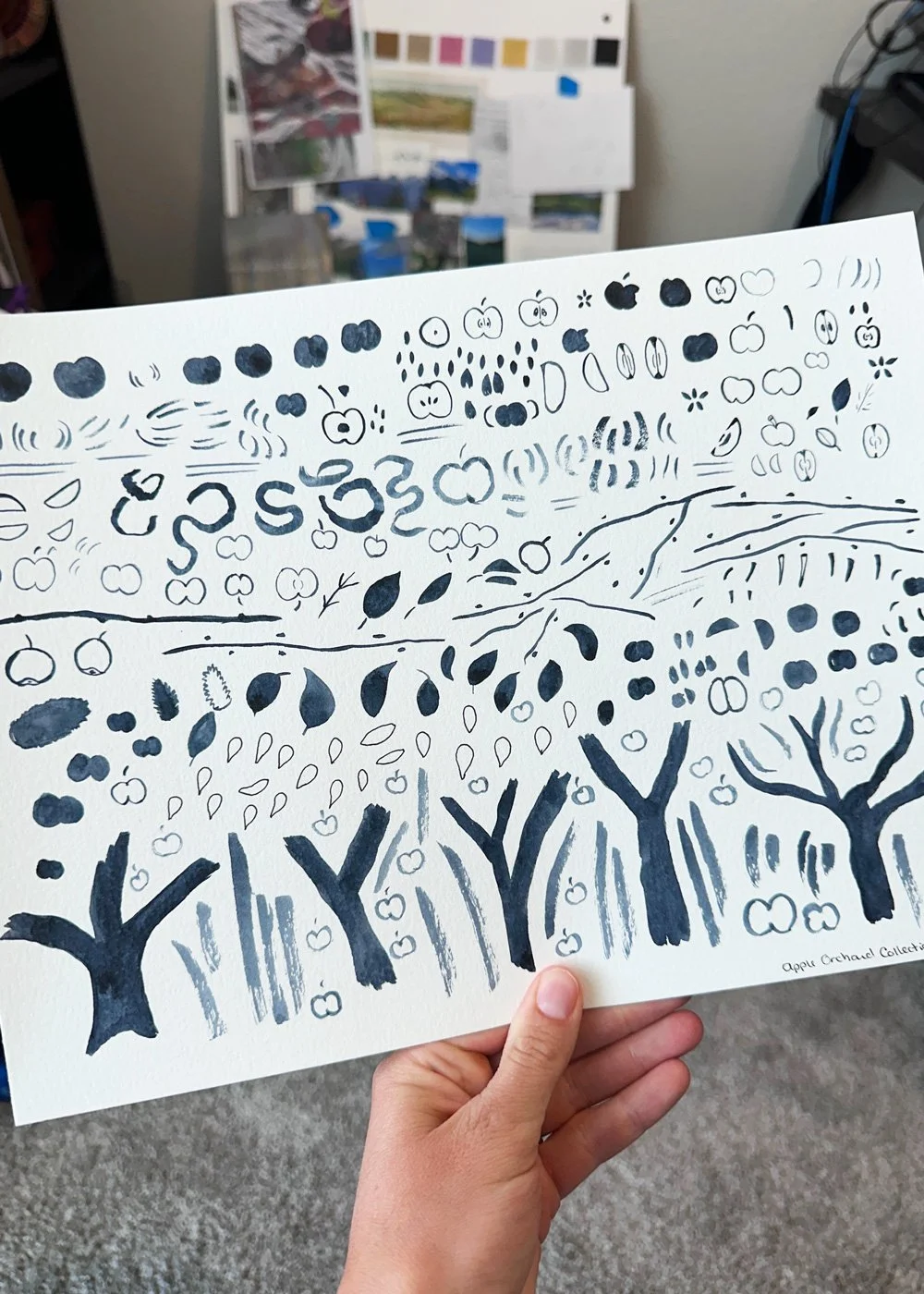 page of watercolor marks with an apple theme