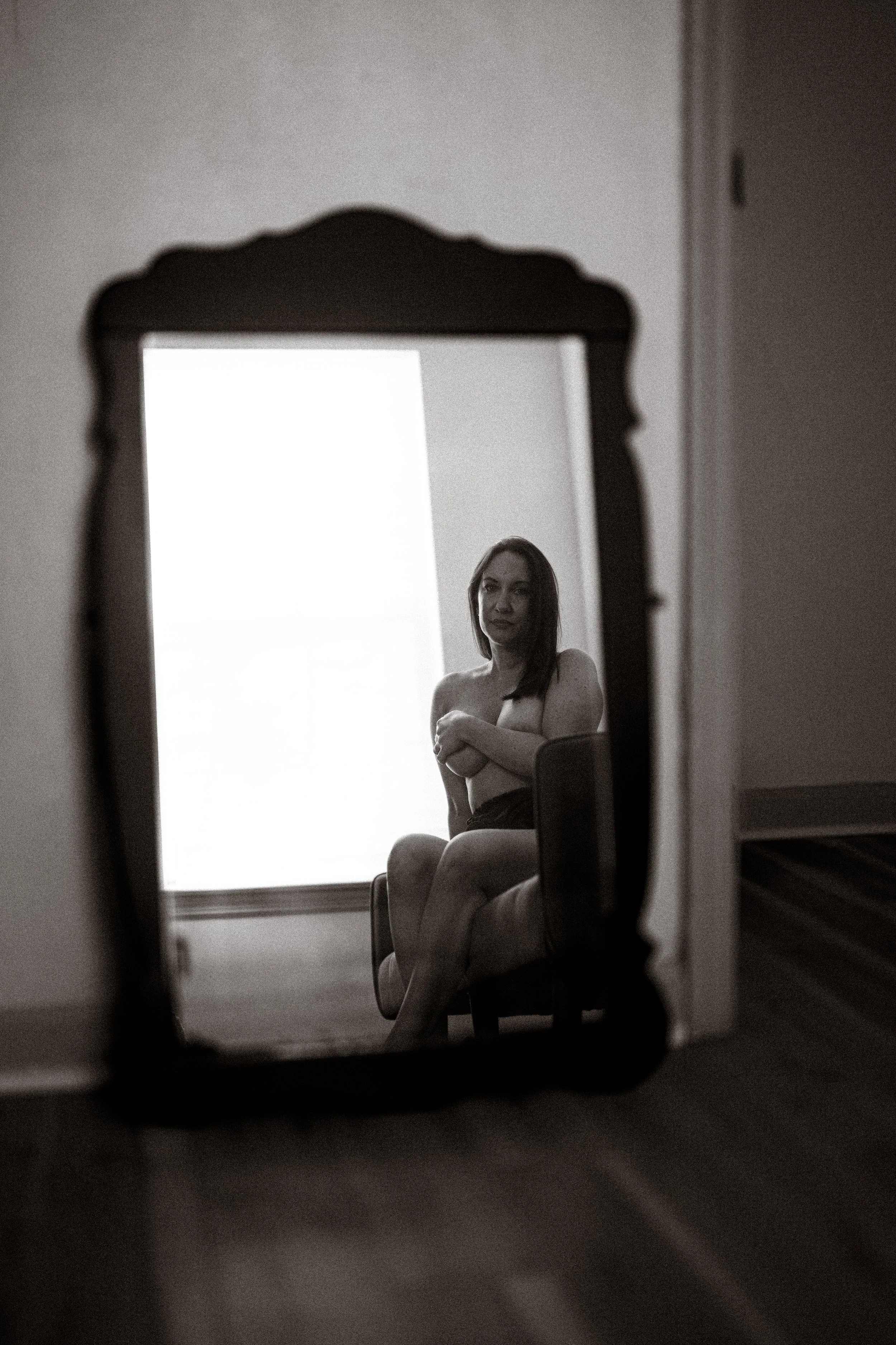 Sophisticated boudoir portrait highlighting natural beauty and elegance.