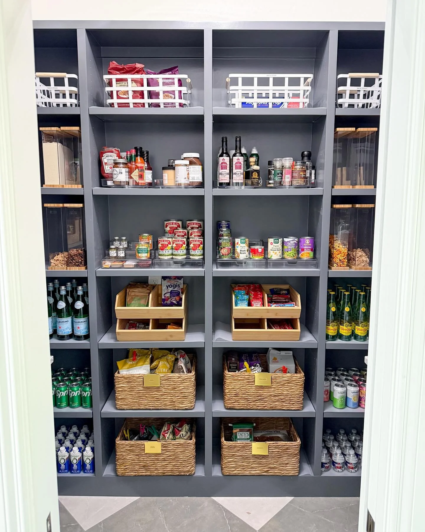 Imagine walking into this pantry everyday. Don&rsquo;t stop there. Imagine the kids getting their afternoon snacks on their own. The condiments and canned food can actually be seen. The water bottles fit perfectly in the divided drawers to the left. 