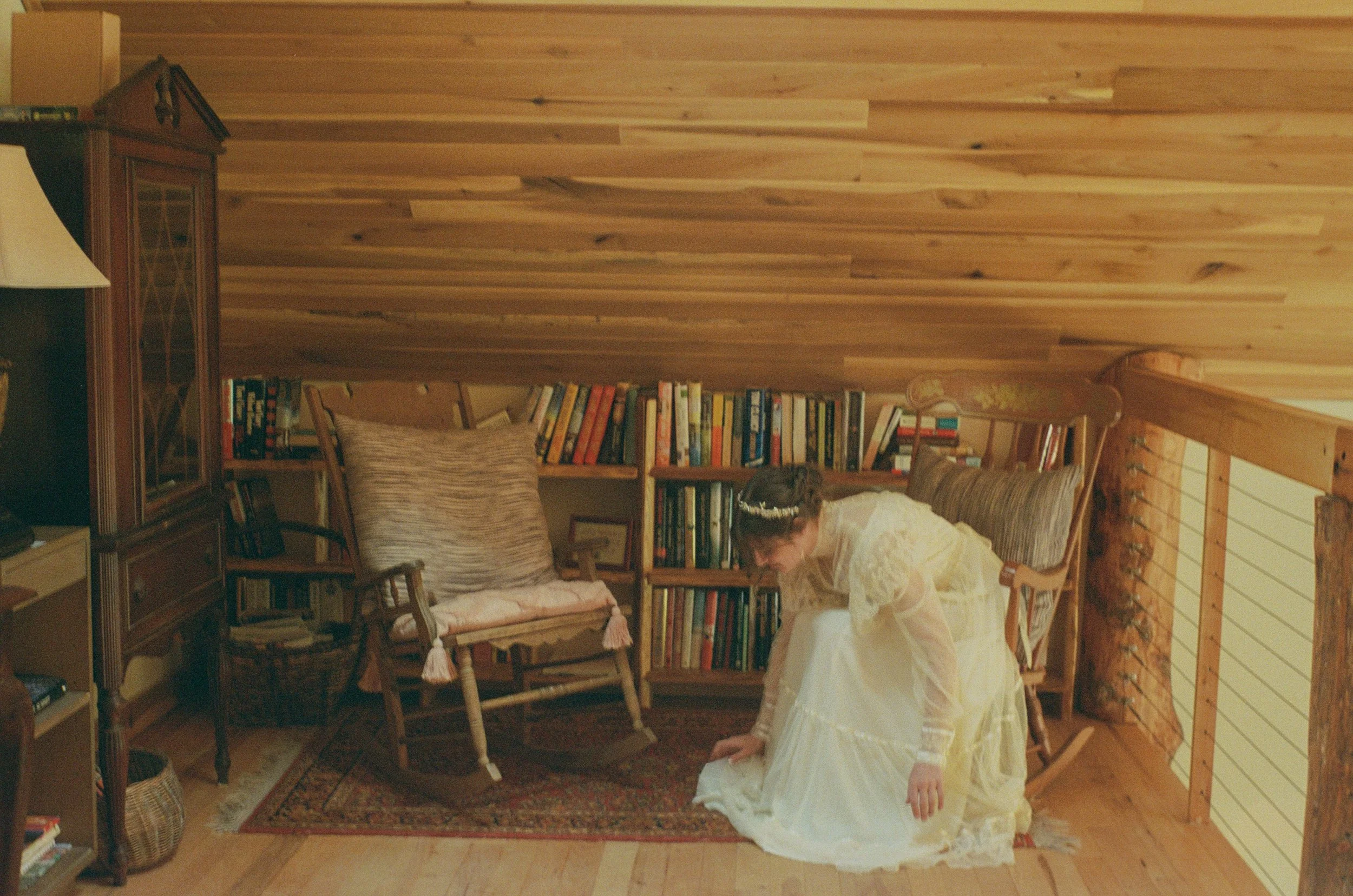 bride fixing dress during vintage  bridal portraits
