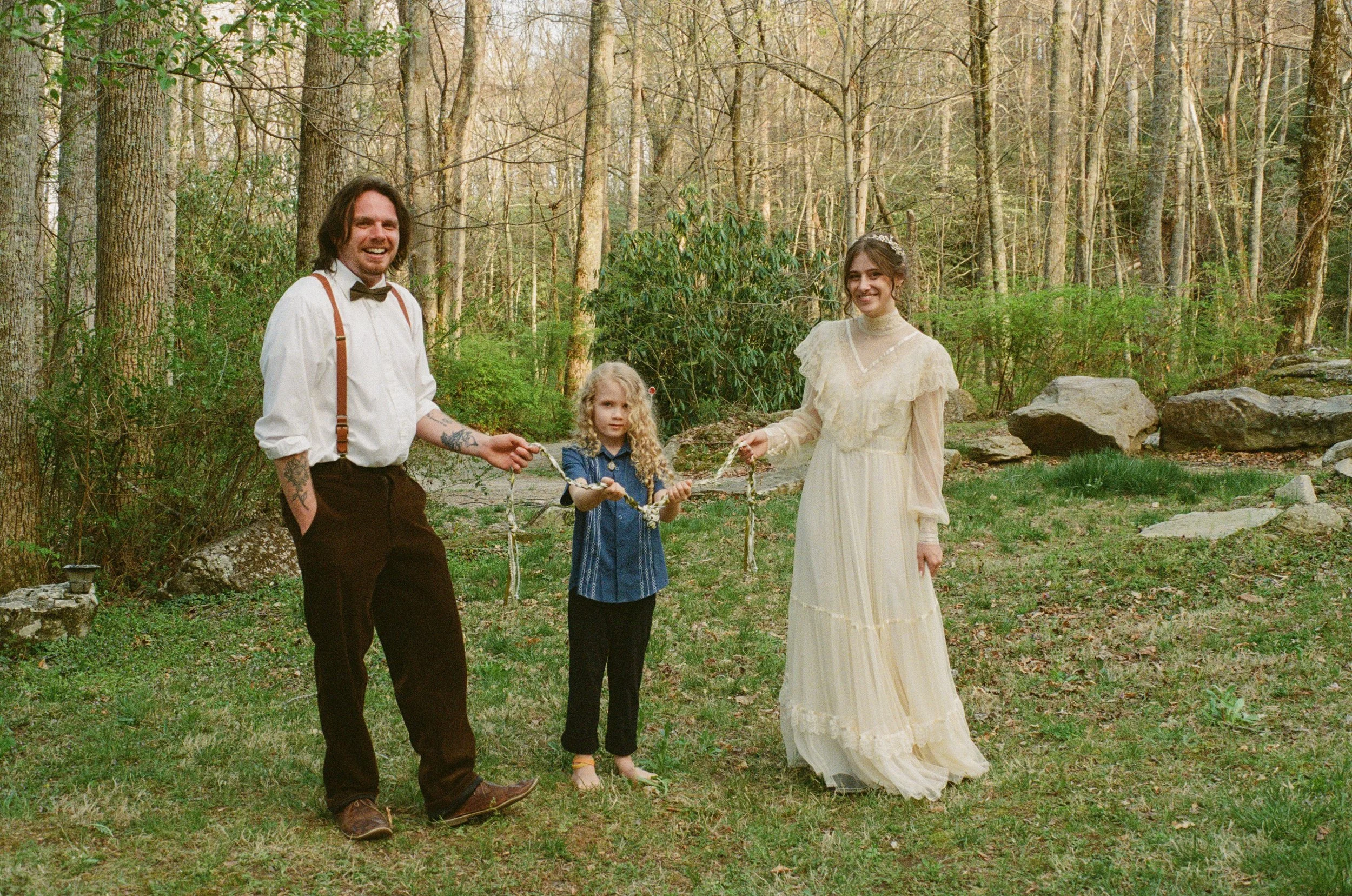 couple holding Celtic rope used during ceremony