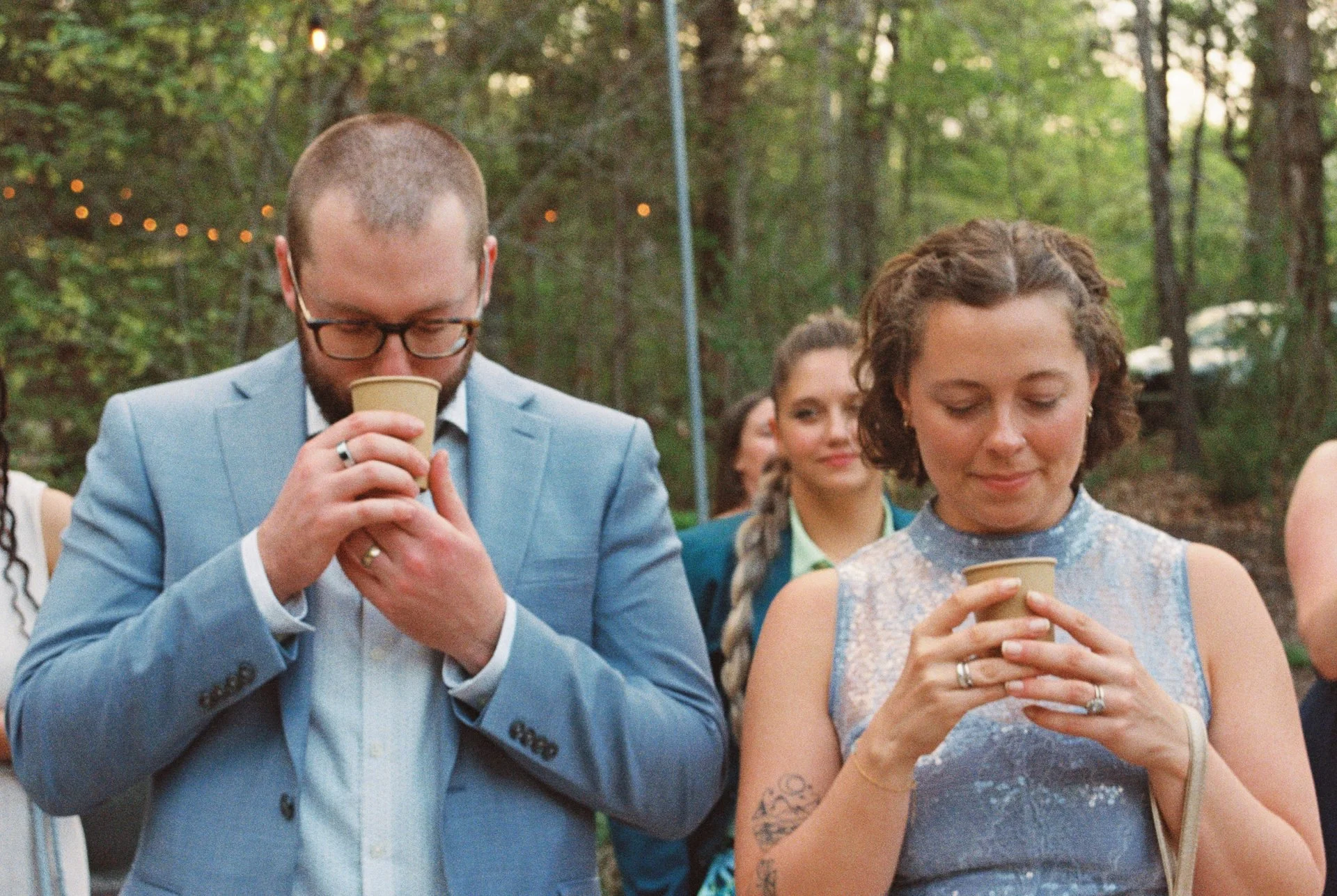 couple speaking intention into cup for newlyweds in a cacao ceremony