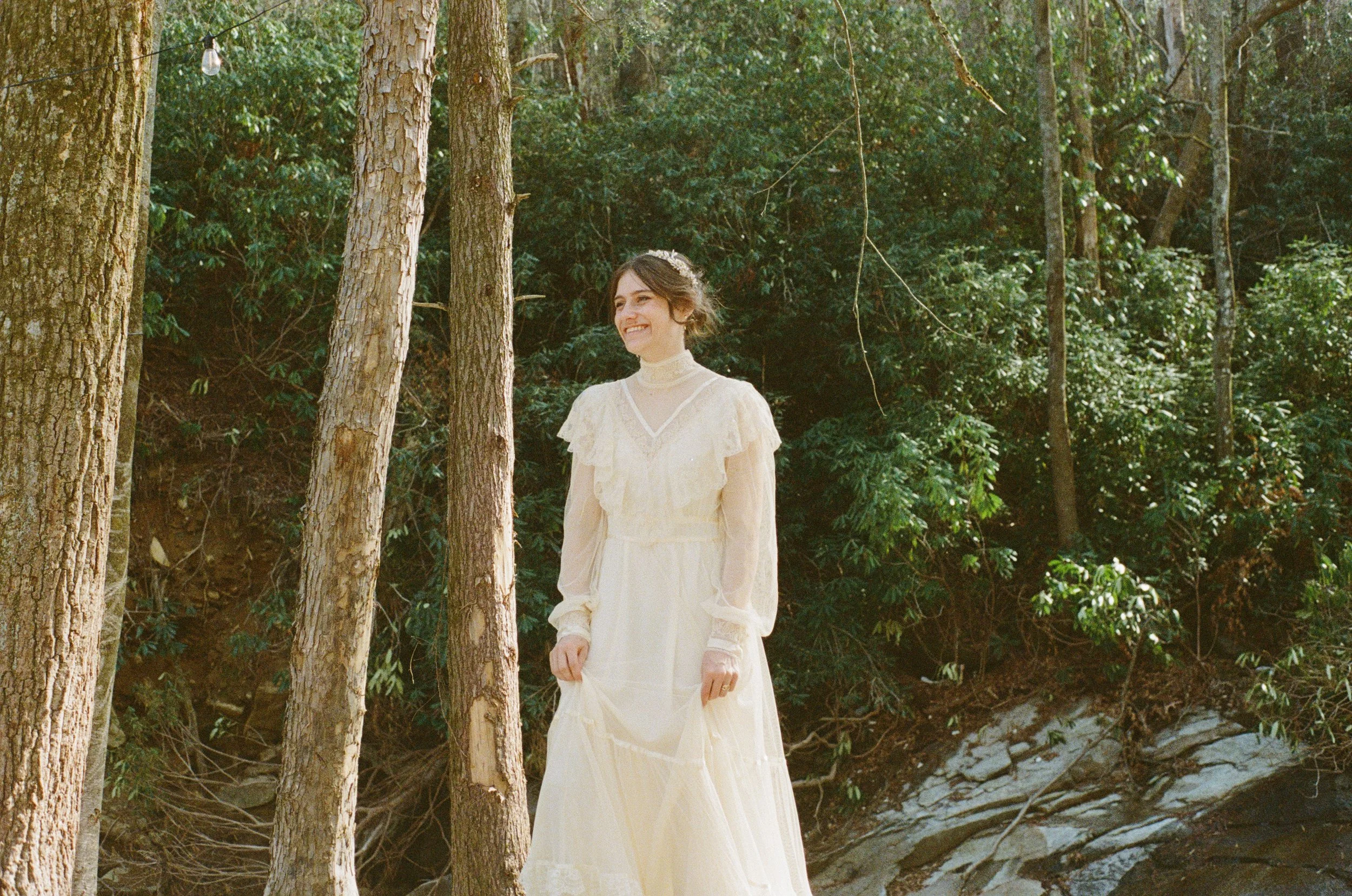 bridal portraits in a vintage gunne sax wedding dress in the river in north carolina