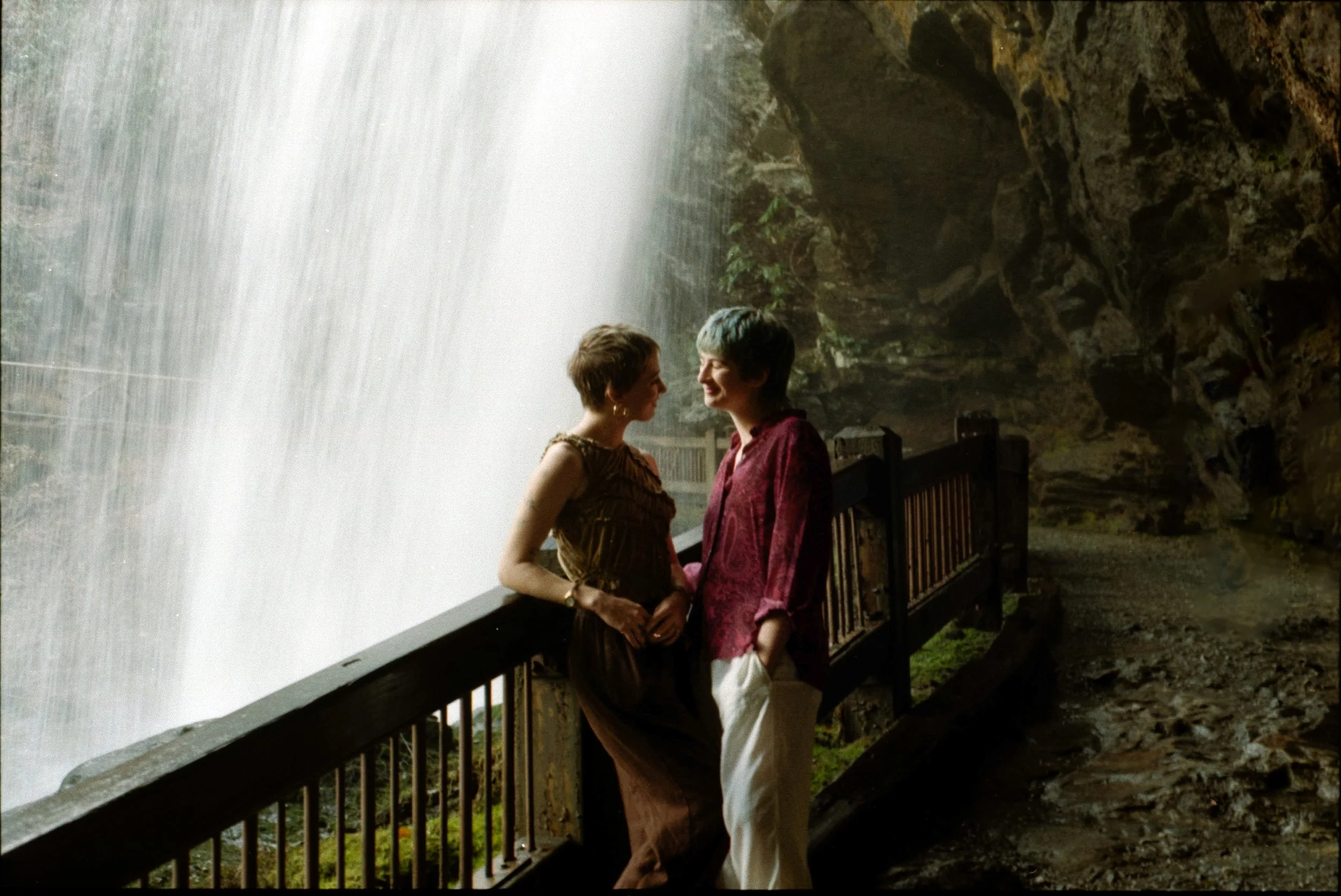couple at waterfall engagement session dry falls highlands north carolina film photography